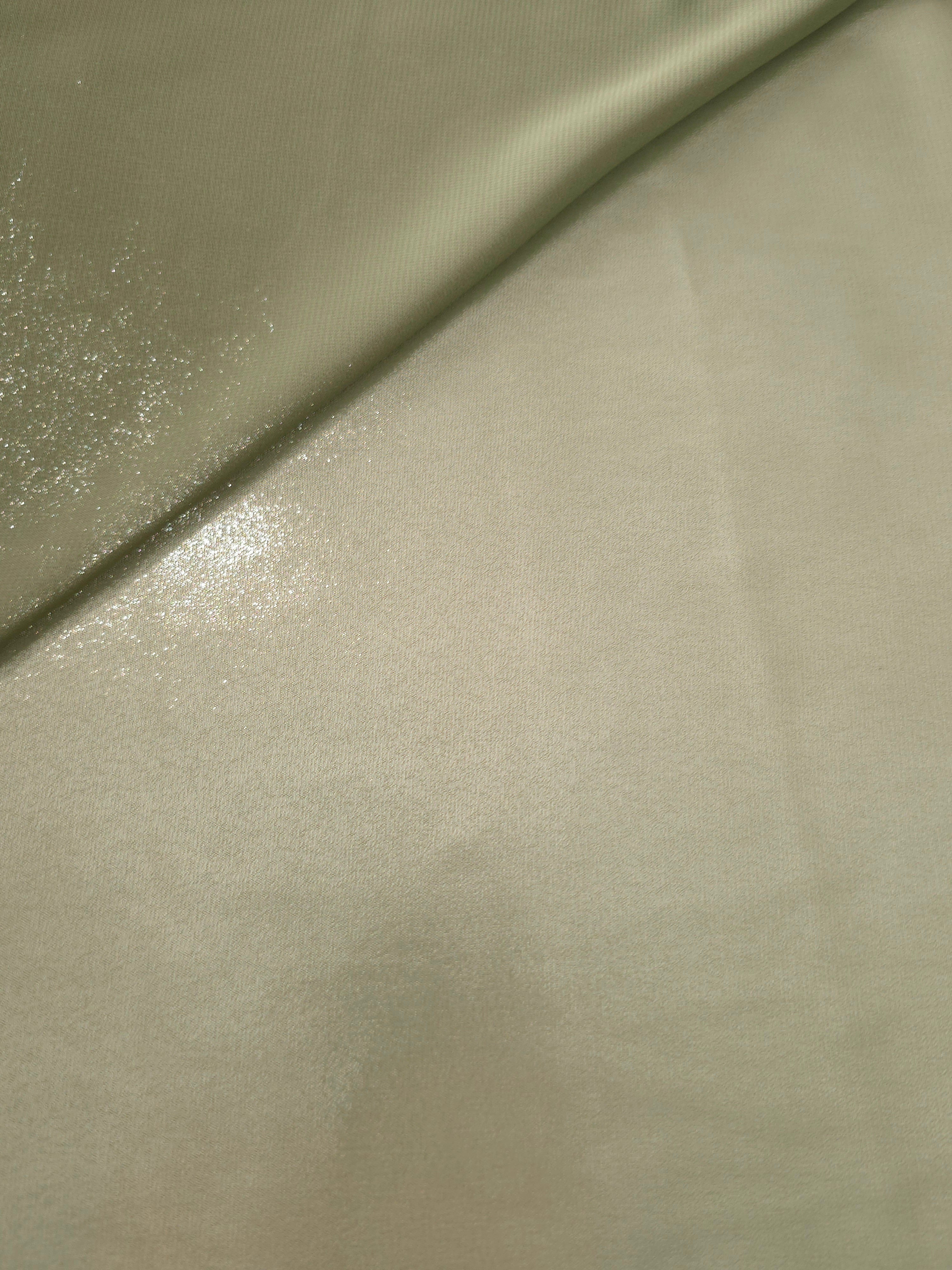 Silver sage soft draping of liquid metallic shimmer chiffon fabric, showing lightweight reflective fabric texture and drape