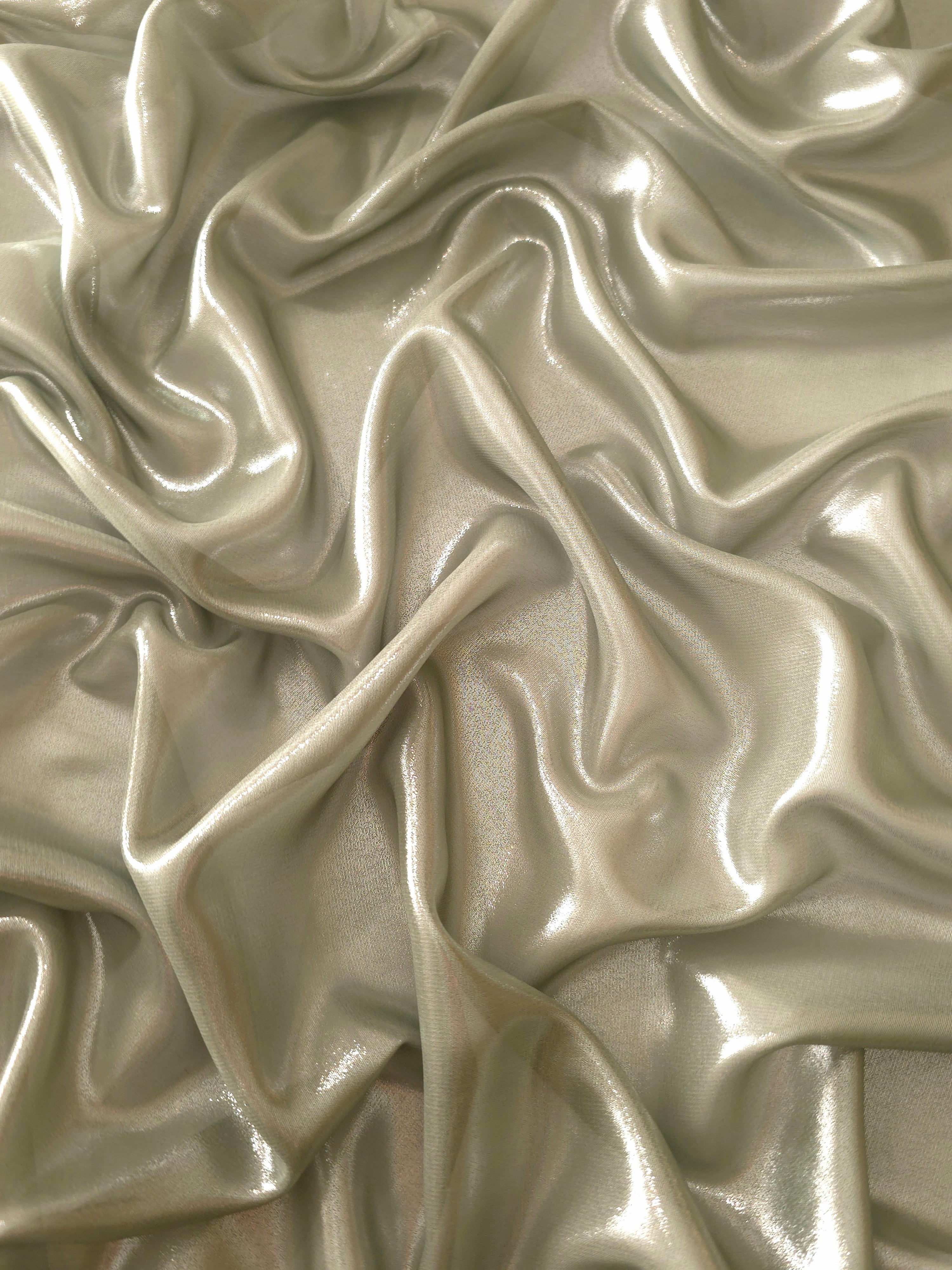 Silver sage surface detail of liquid metallic shimmer chiffon fabric, showing lightweight reflective fabric texture and drape