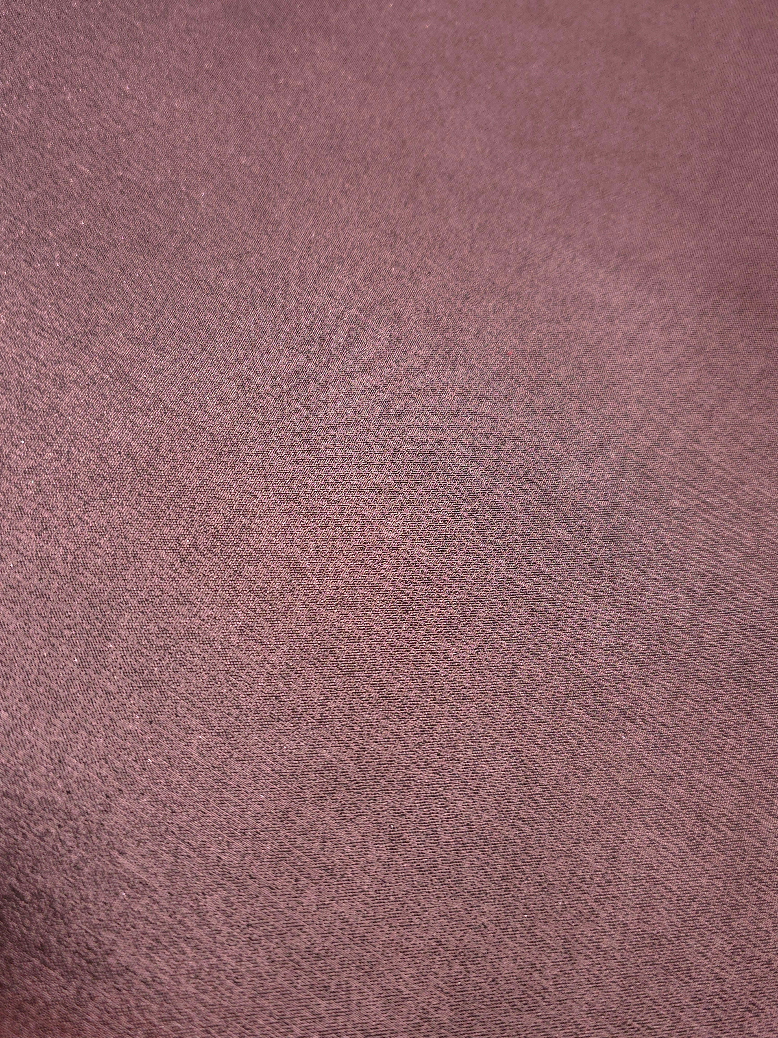 Smoky mauve fold detail view of liquid metallic shimmer chiffon fabric, highlighting fluid folds and reflective surface