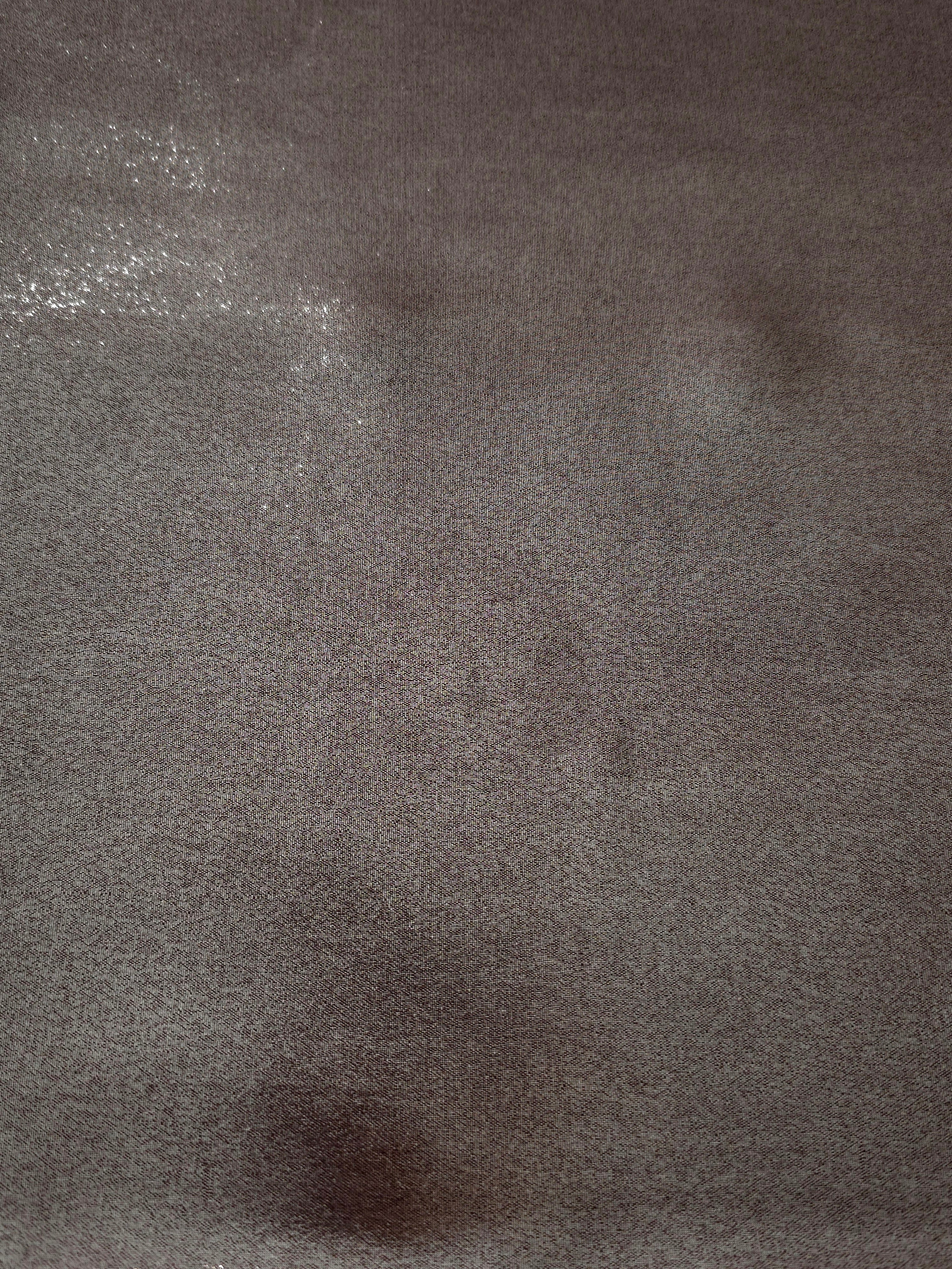Smoky pewter fabric overview view of liquid metallic shimmer chiffon fabric, highlighting fluid folds and reflective surface