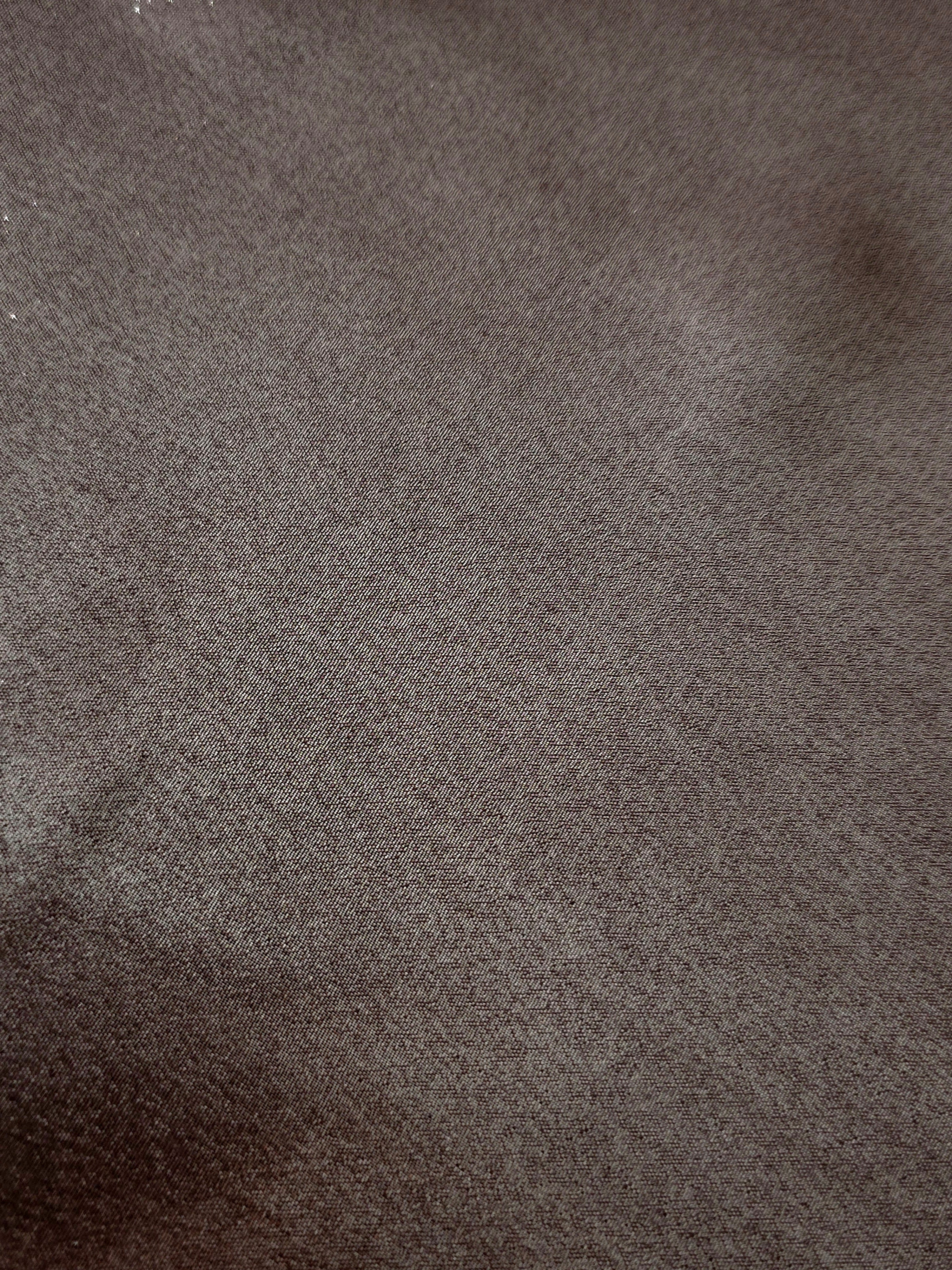 Smoky pewter fold detail view of liquid metallic shimmer chiffon fabric, highlighting fluid folds and reflective surface