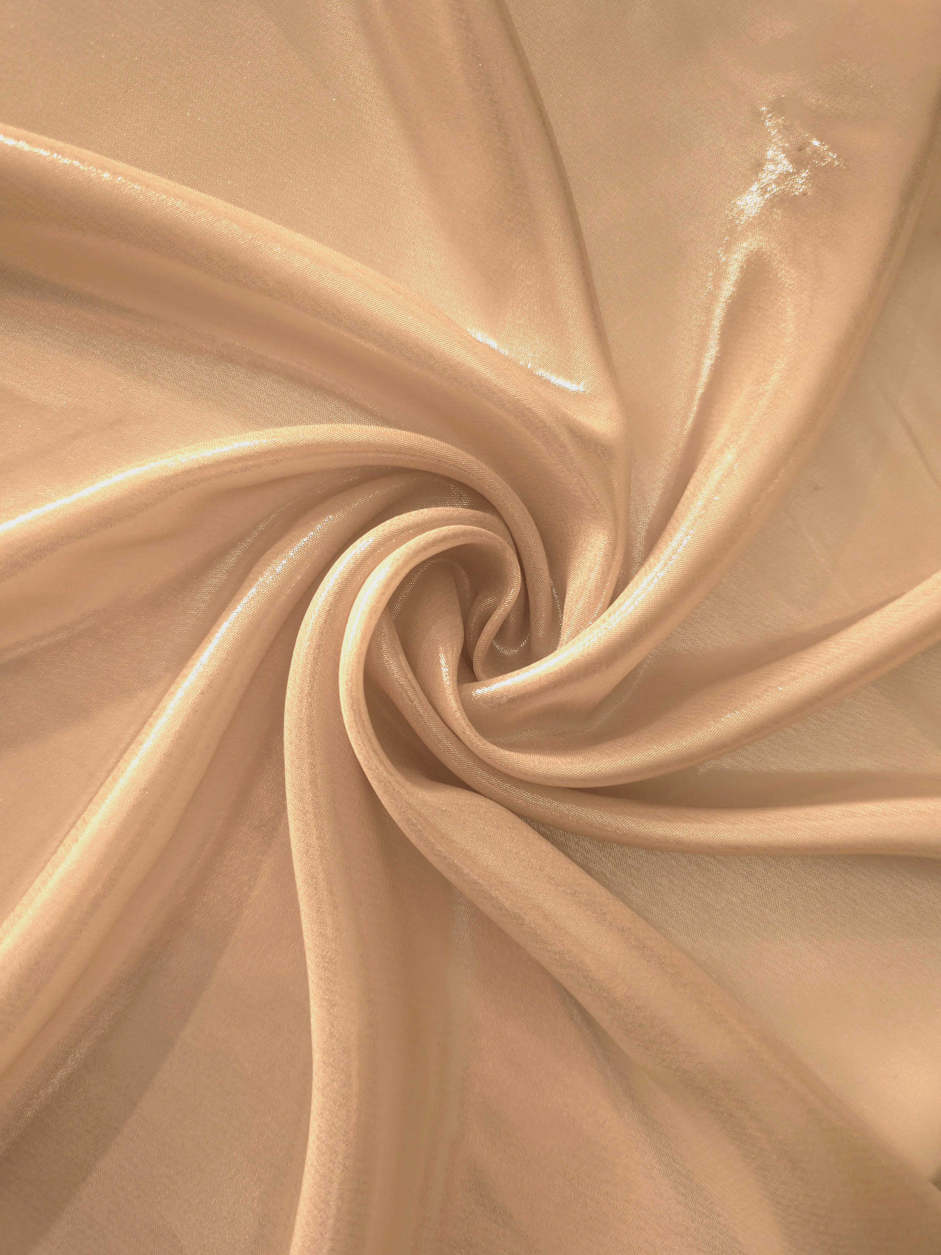 Soft taupe shimmer close-up of liquid metallic shimmer chiffon fabric, showing lightweight reflective fabric texture and drape