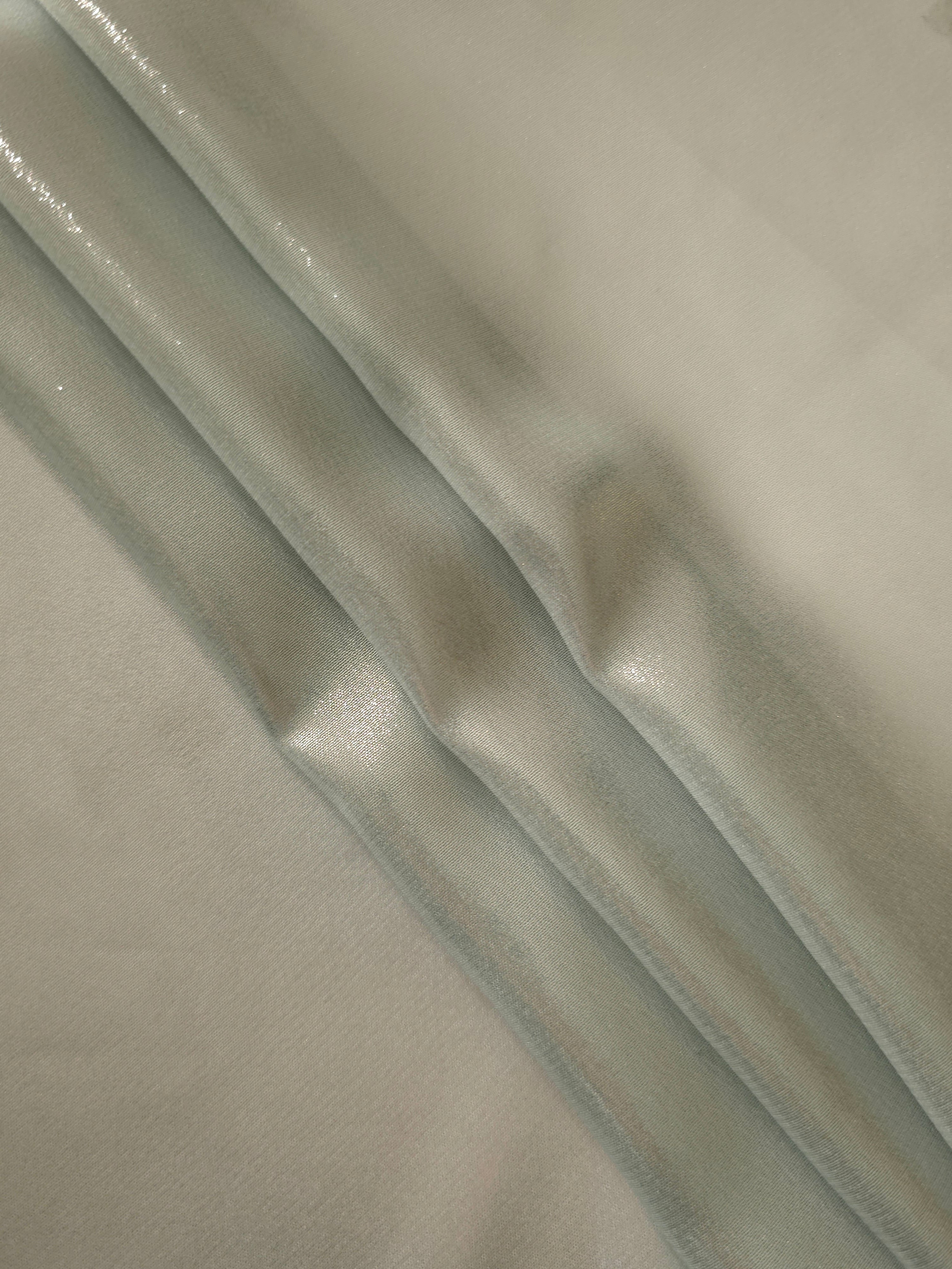 Stone greige flowing folds of liquid metallic shimmer chiffon fabric, showing lightweight reflective fabric texture and drape