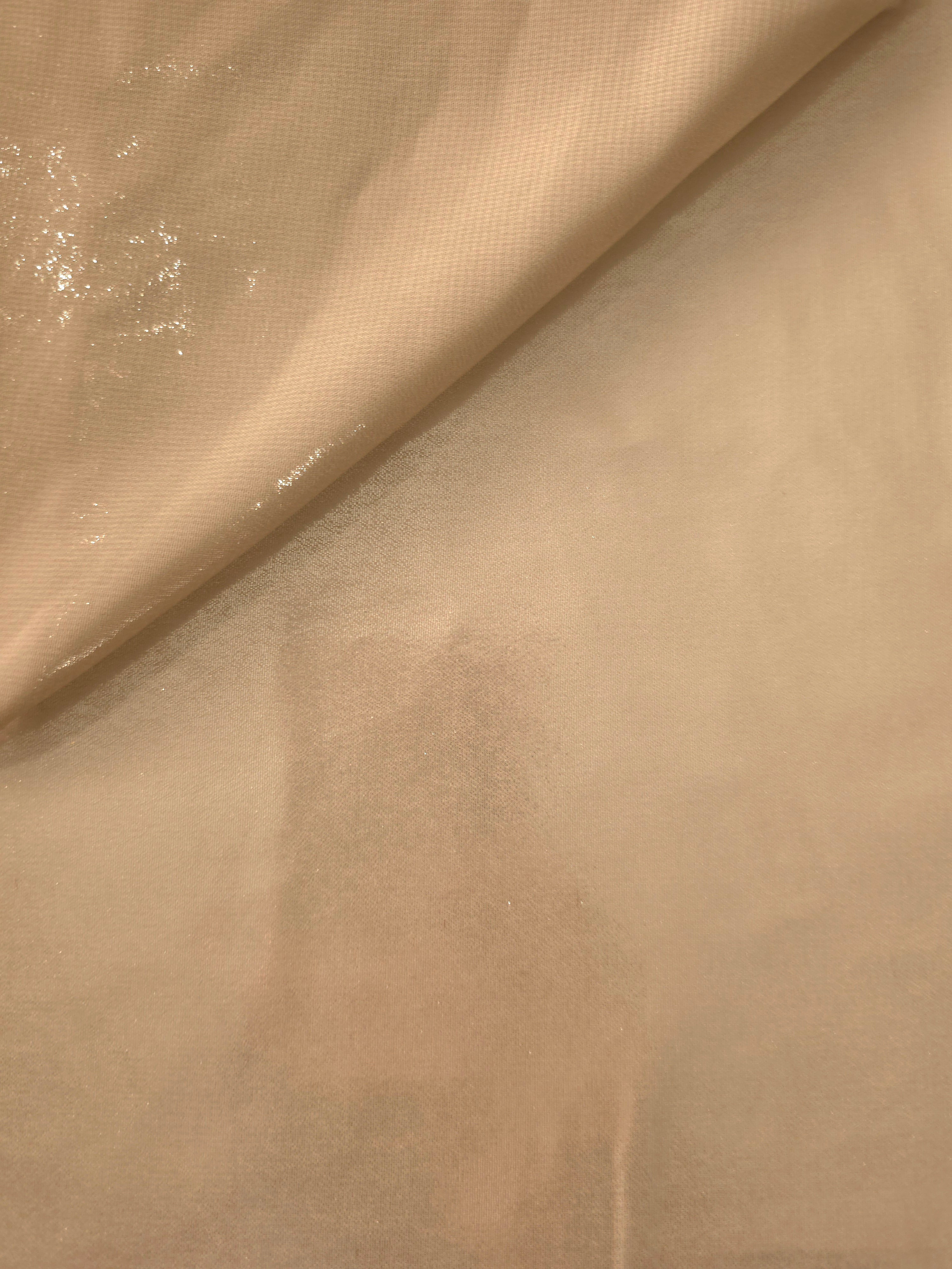 Warm sand soft draping of liquid metallic shimmer chiffon fabric, showing lightweight reflective fabric texture and drape