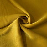 Mustard Yellow sandwashed polyamide fabric showing a soft folded drape