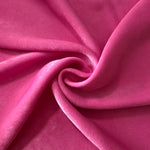 Raspberry Pink sandwashed polyamide fabric showing a soft folded drape