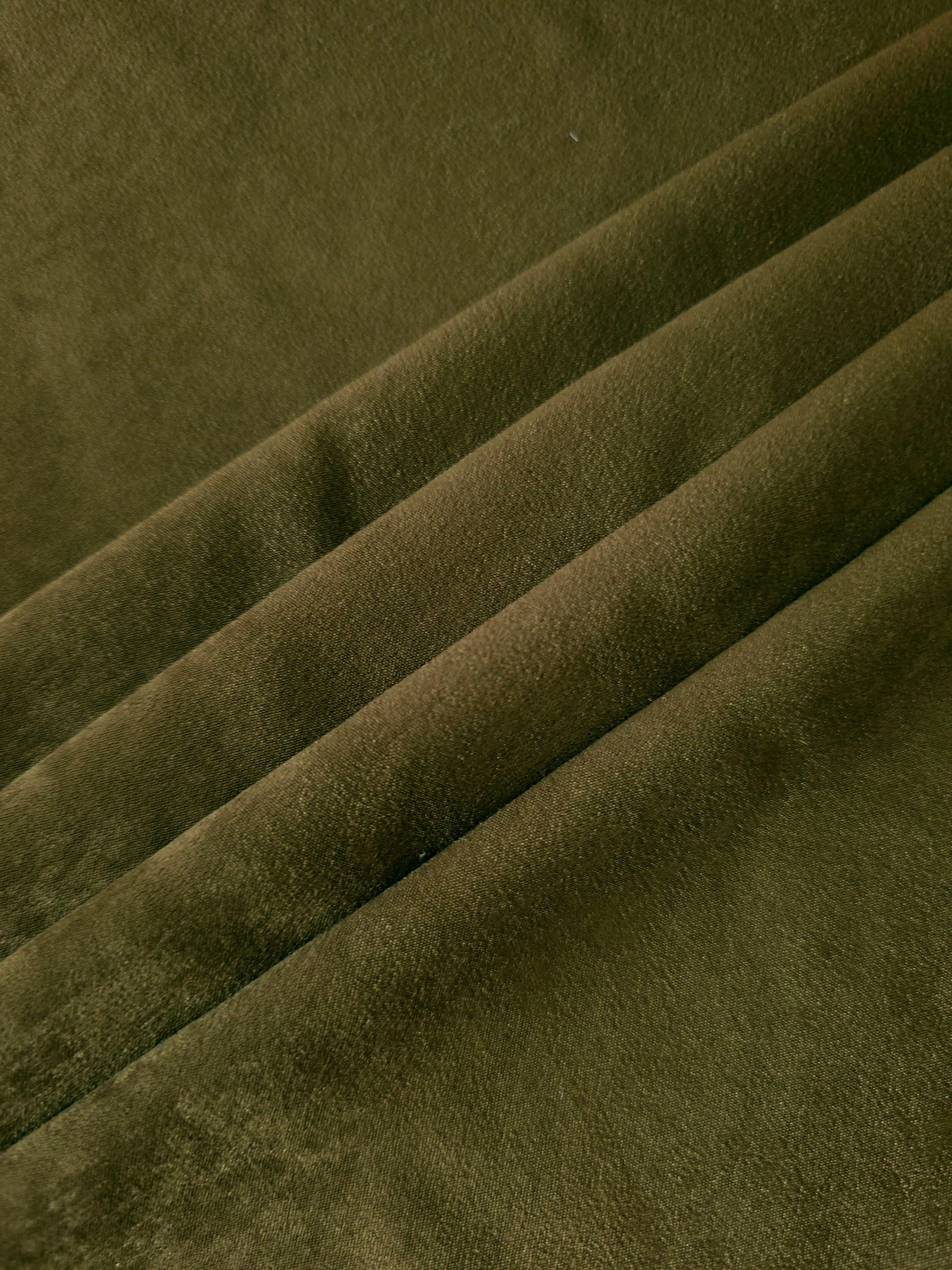Deep Olive sandwashed polyamide fabric showing a soft folded drape