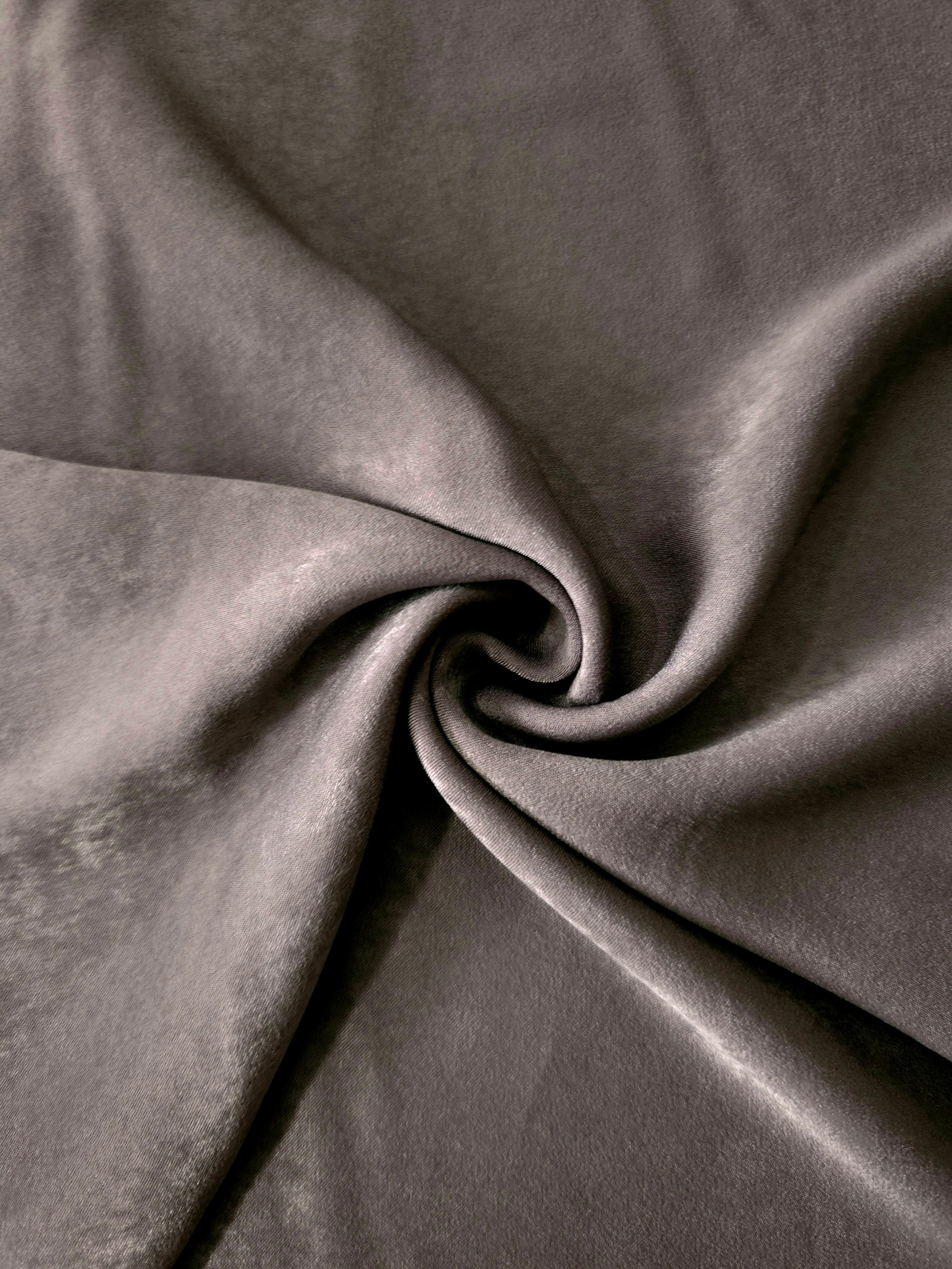 Smoked Charcoal sandwashed polyamide fabric showing a soft folded drape