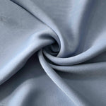 Silver Blue sandwashed polyamide fabric showing a soft folded drape