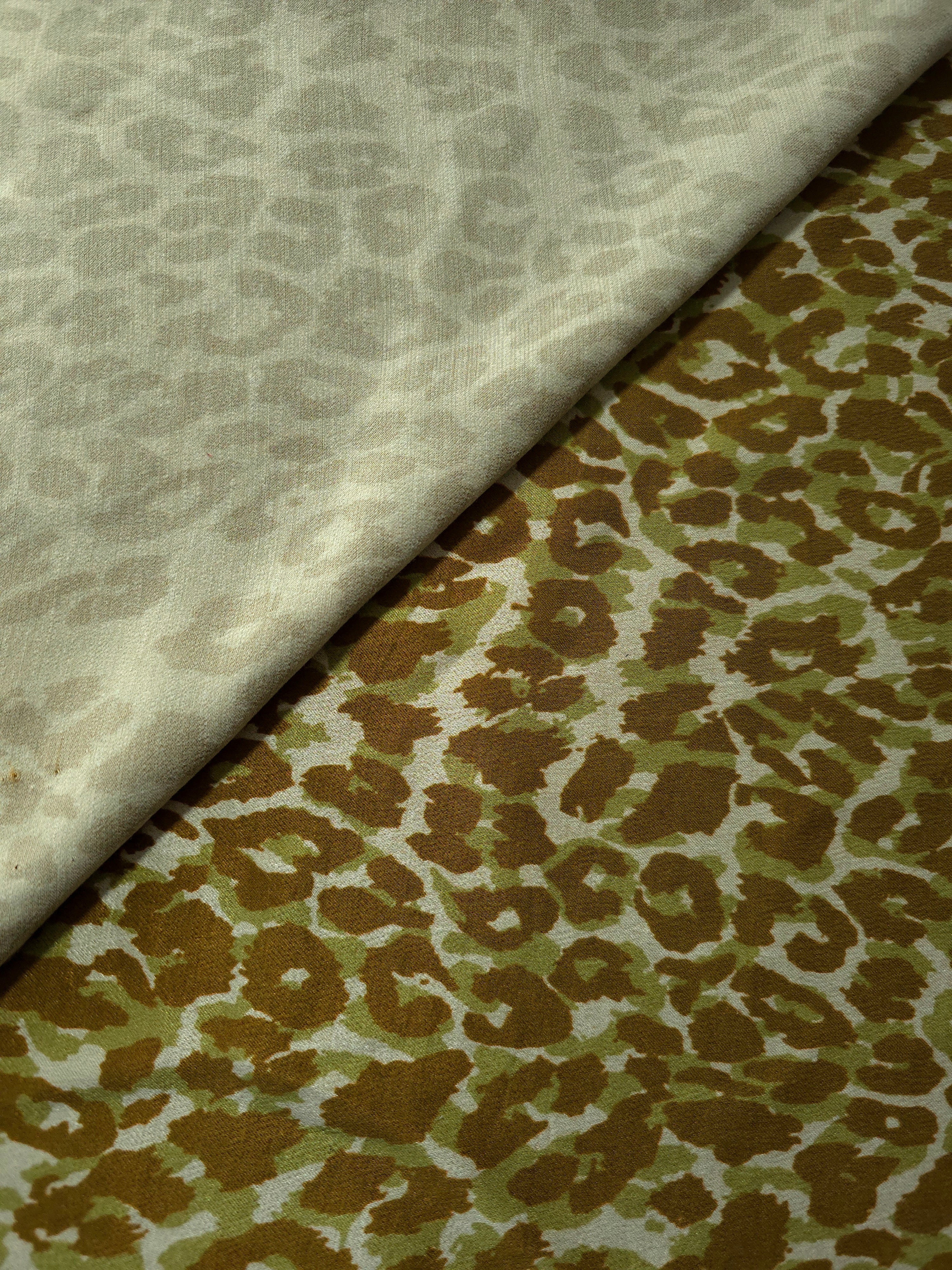 Close-up texture of Bej D7586IJ4 leopard lyocell viscose digital print fabric.