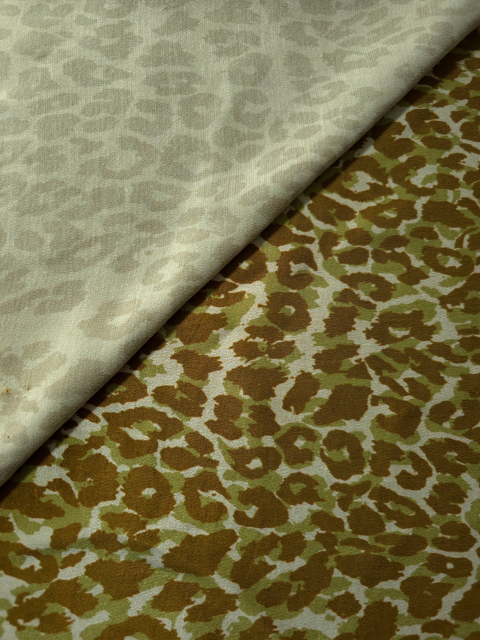 Close-up texture of Bej D7586IJ4 leopard lyocell viscose digital print fabric.