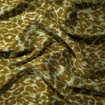 Soft drape folds of Bej D7586IJ4 leopard lyocell viscose digital print fabric.