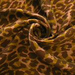 Angled print detail of Kahve D7586IJ4 leopard lyocell viscose digital print fabric.