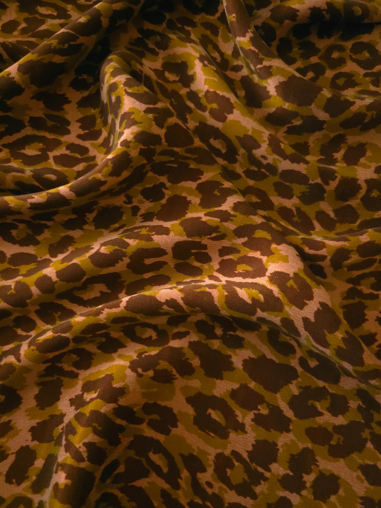 Soft drape folds of Kahve D7586IJ4 leopard lyocell viscose digital print fabric.