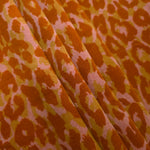 Angled print detail of Pudra D7586IJ4 leopard lyocell viscose digital print fabric.