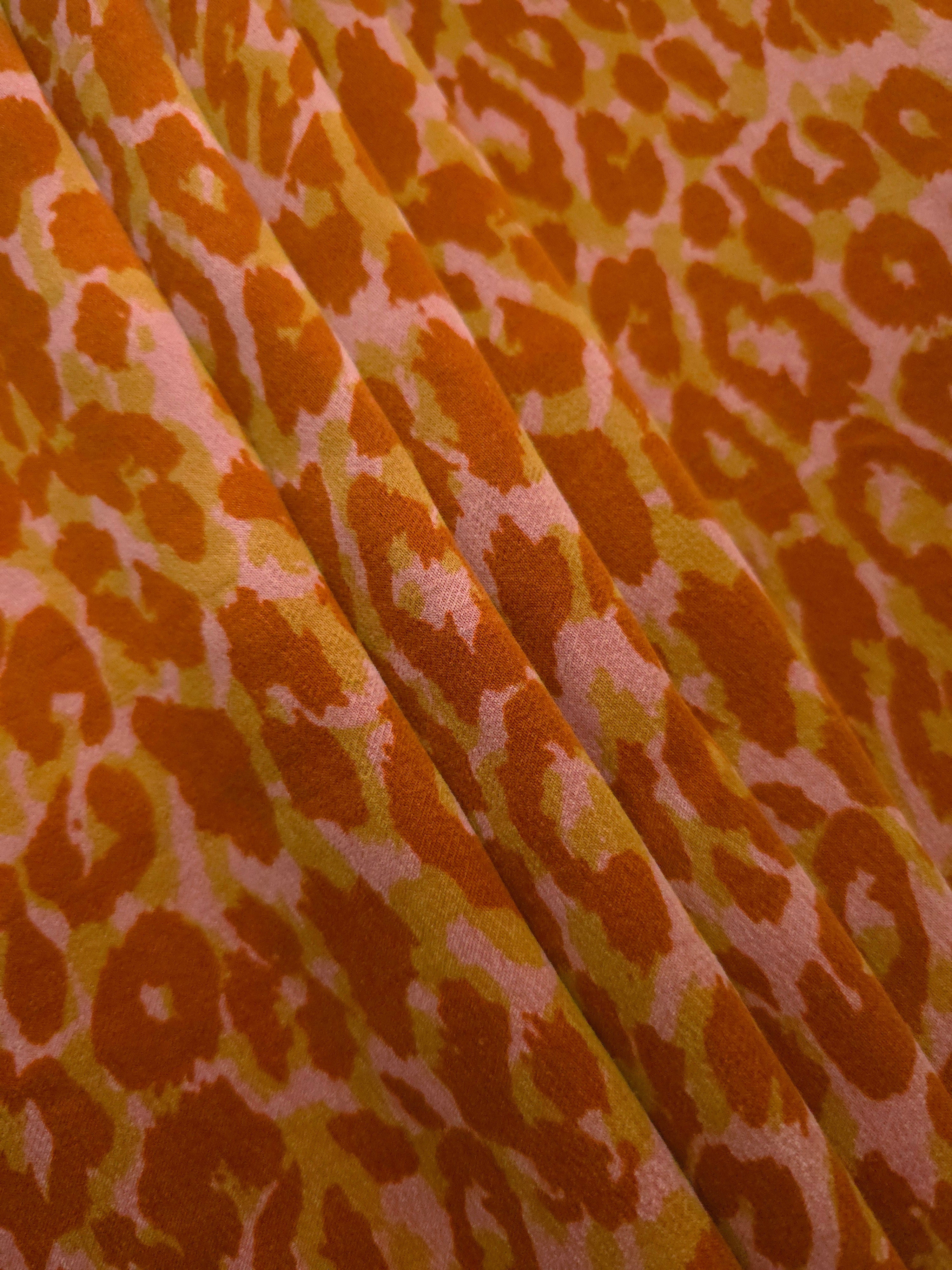 Angled print detail of Pudra D7586IJ4 leopard lyocell viscose digital print fabric.