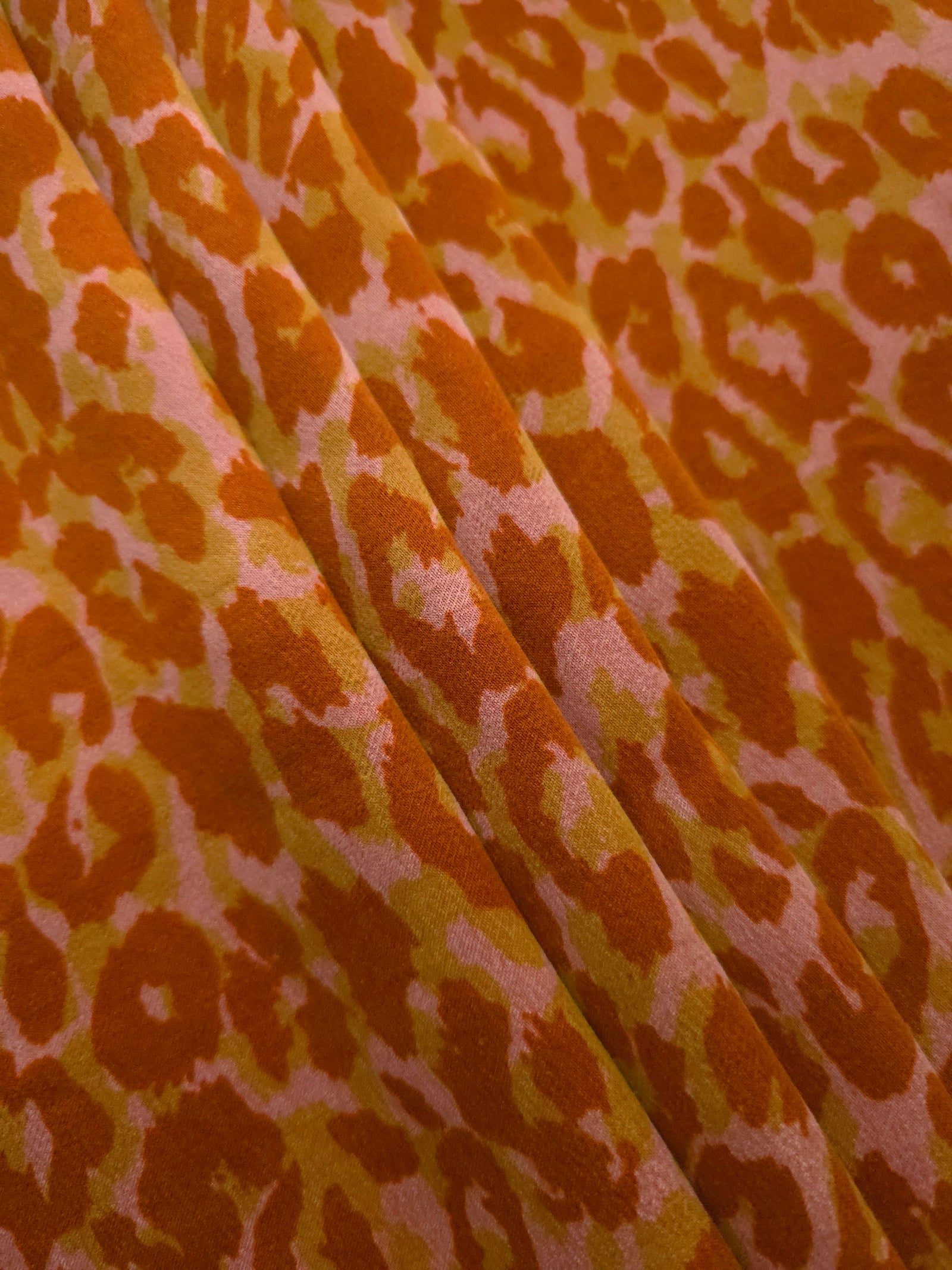 Angled print detail of Pudra D7586IJ4 leopard lyocell viscose digital print fabric.
