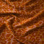 Soft drape folds of Pudra D7586IJ4 leopard lyocell viscose digital print fabric.