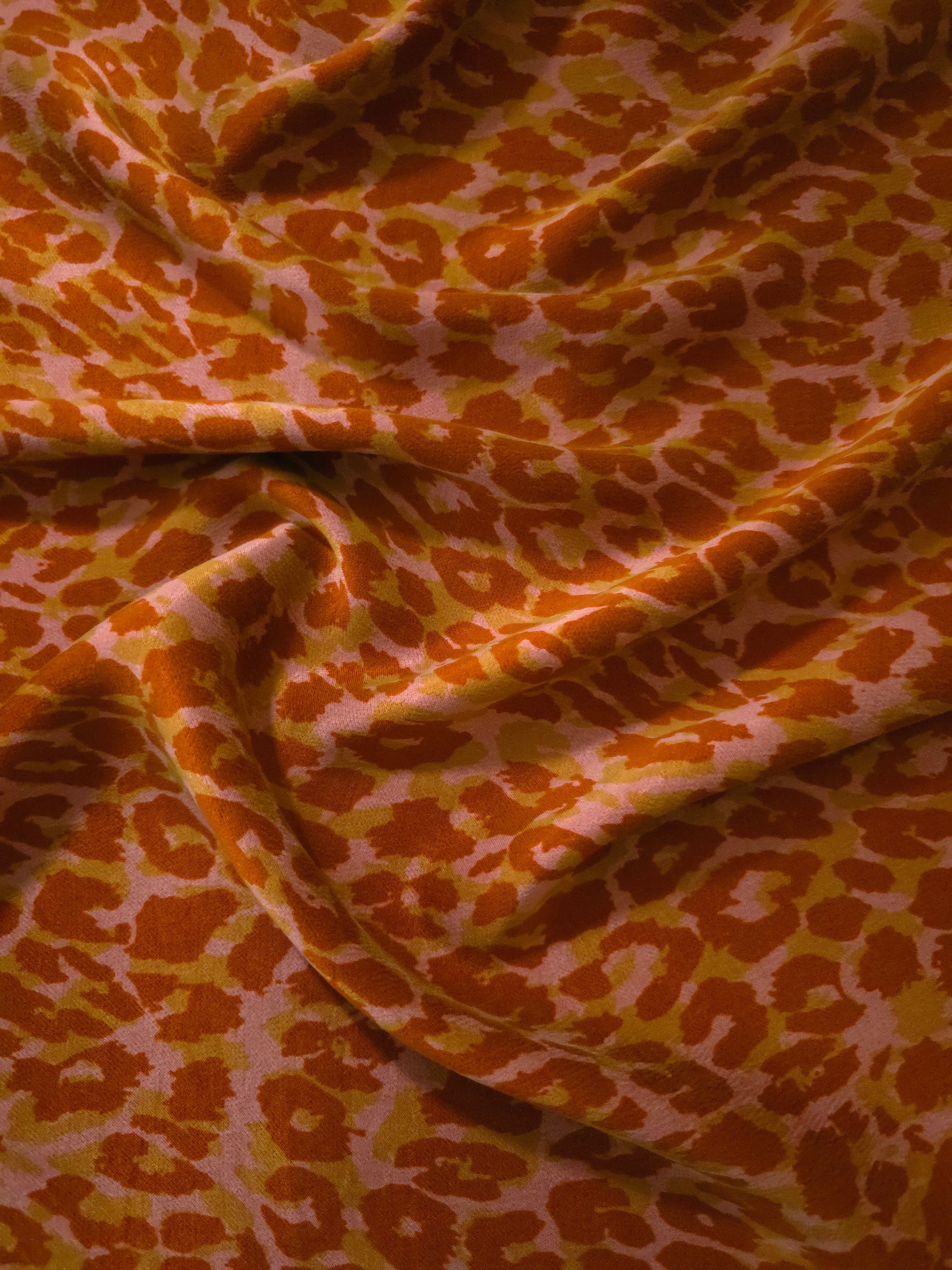 Soft drape folds of Pudra D7586IJ4 leopard lyocell viscose digital print fabric.