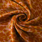 Swirl drape view of Pudra D7586IJ4 leopard lyocell viscose digital print fabric.