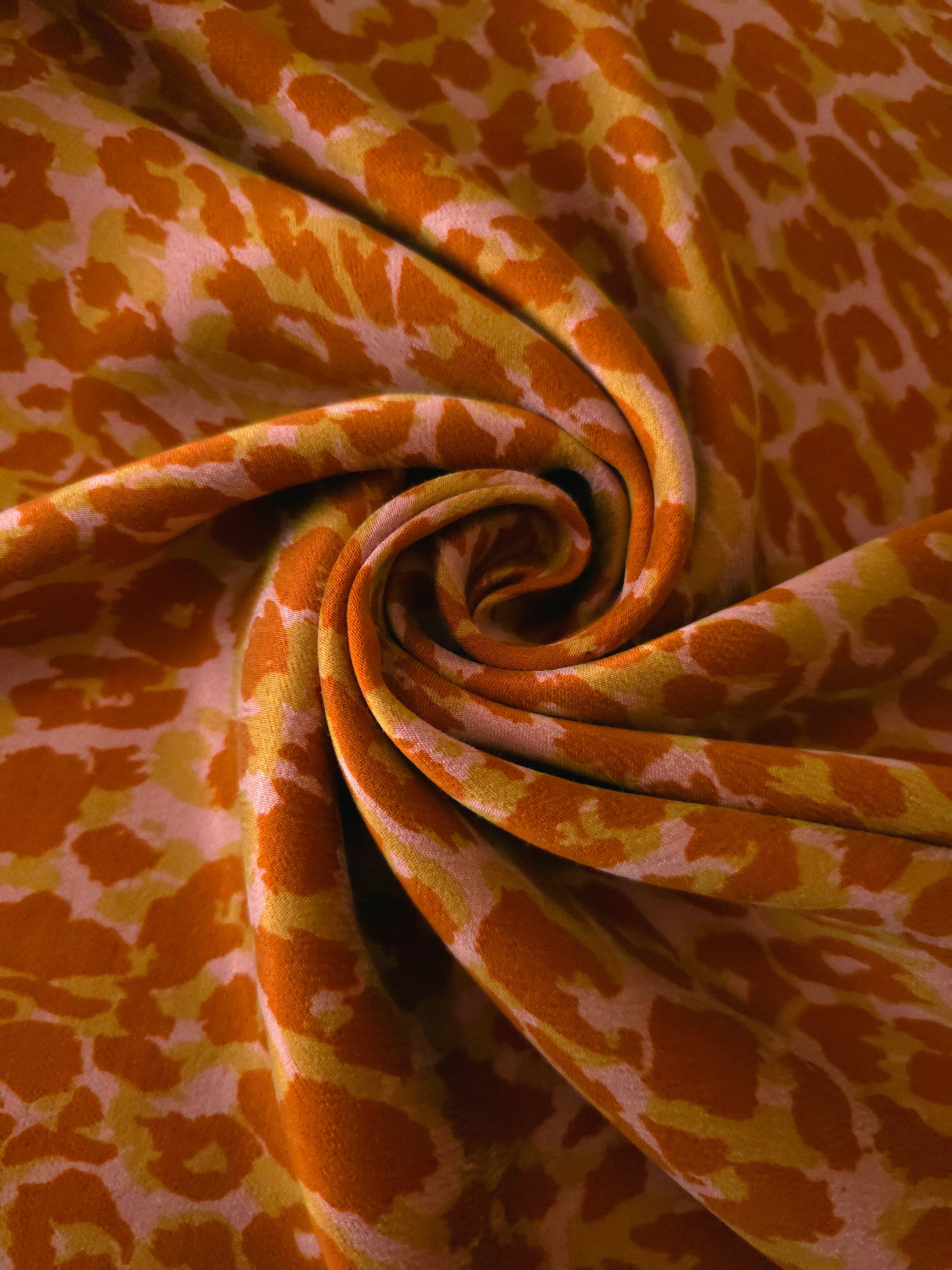 Swirl drape view of Pudra D7586IJ4 leopard lyocell viscose digital print fabric.