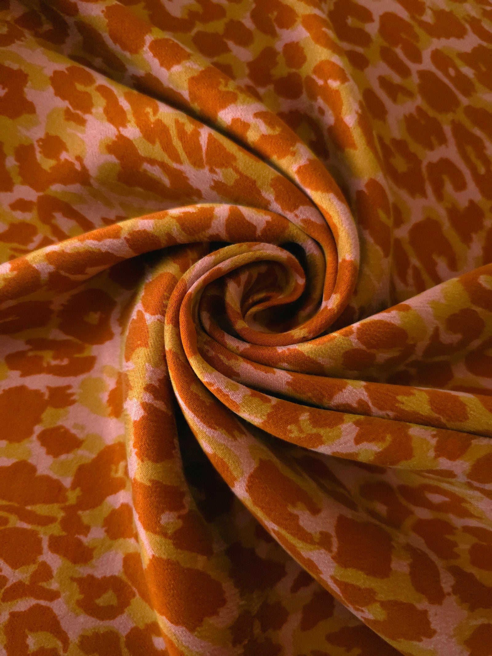 Swirl drape view of Pudra D7586IJ4 leopard lyocell viscose digital print fabric.
