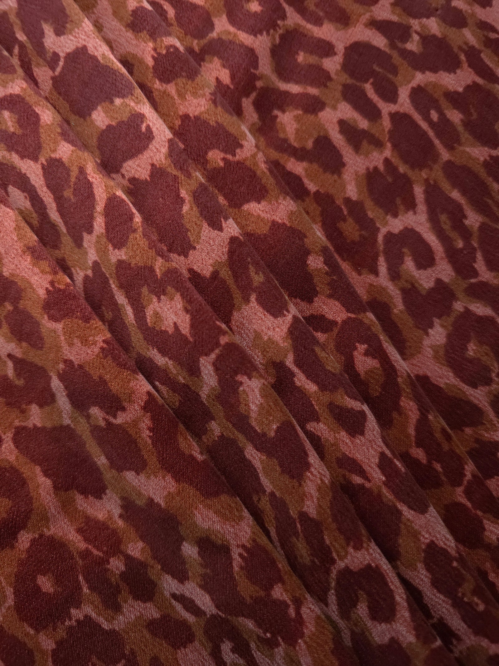Angled print detail of Taba D7586IJ4 leopard lyocell viscose digital print fabric.