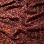 Soft drape folds of Taba D7586IJ4 leopard lyocell viscose digital print fabric.