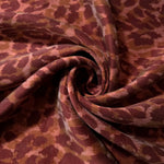 Swirl drape view of Taba D7586IJ4 leopard lyocell viscose digital print fabric.
