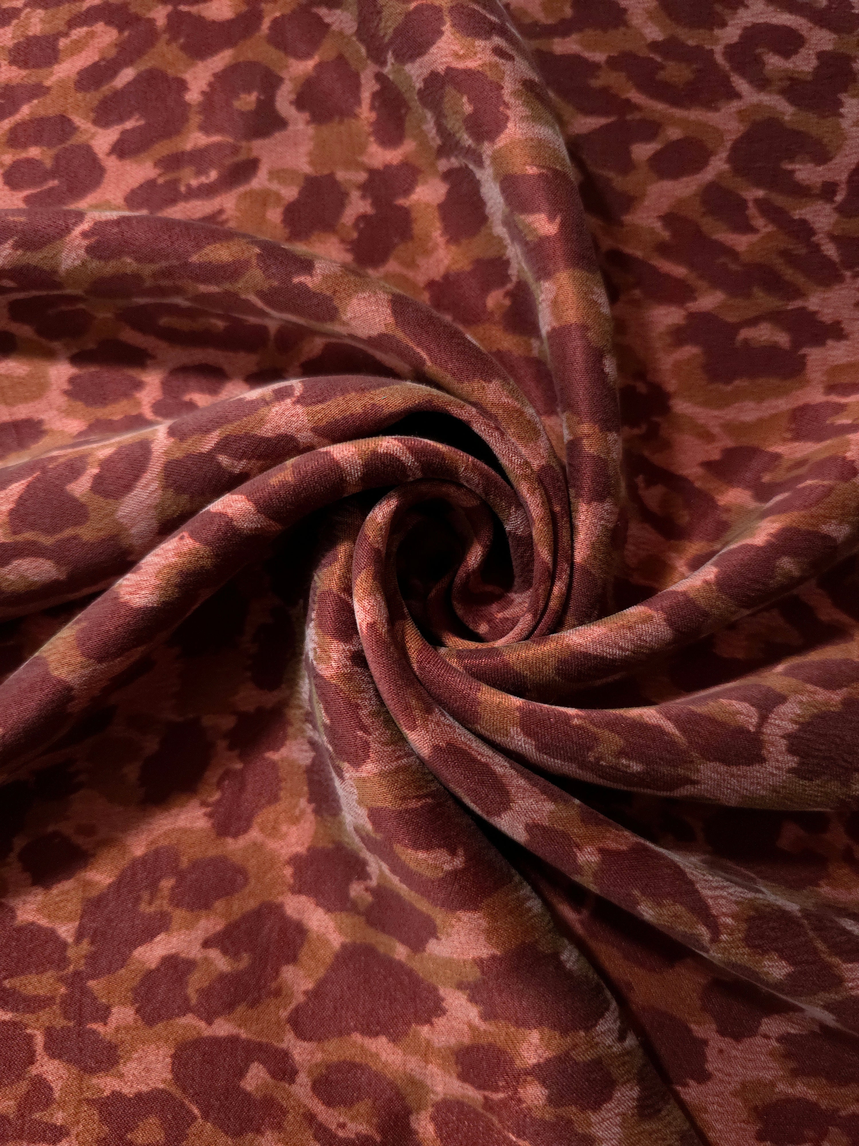 Swirl drape view of Taba D7586IJ4 leopard lyocell viscose digital print fabric.