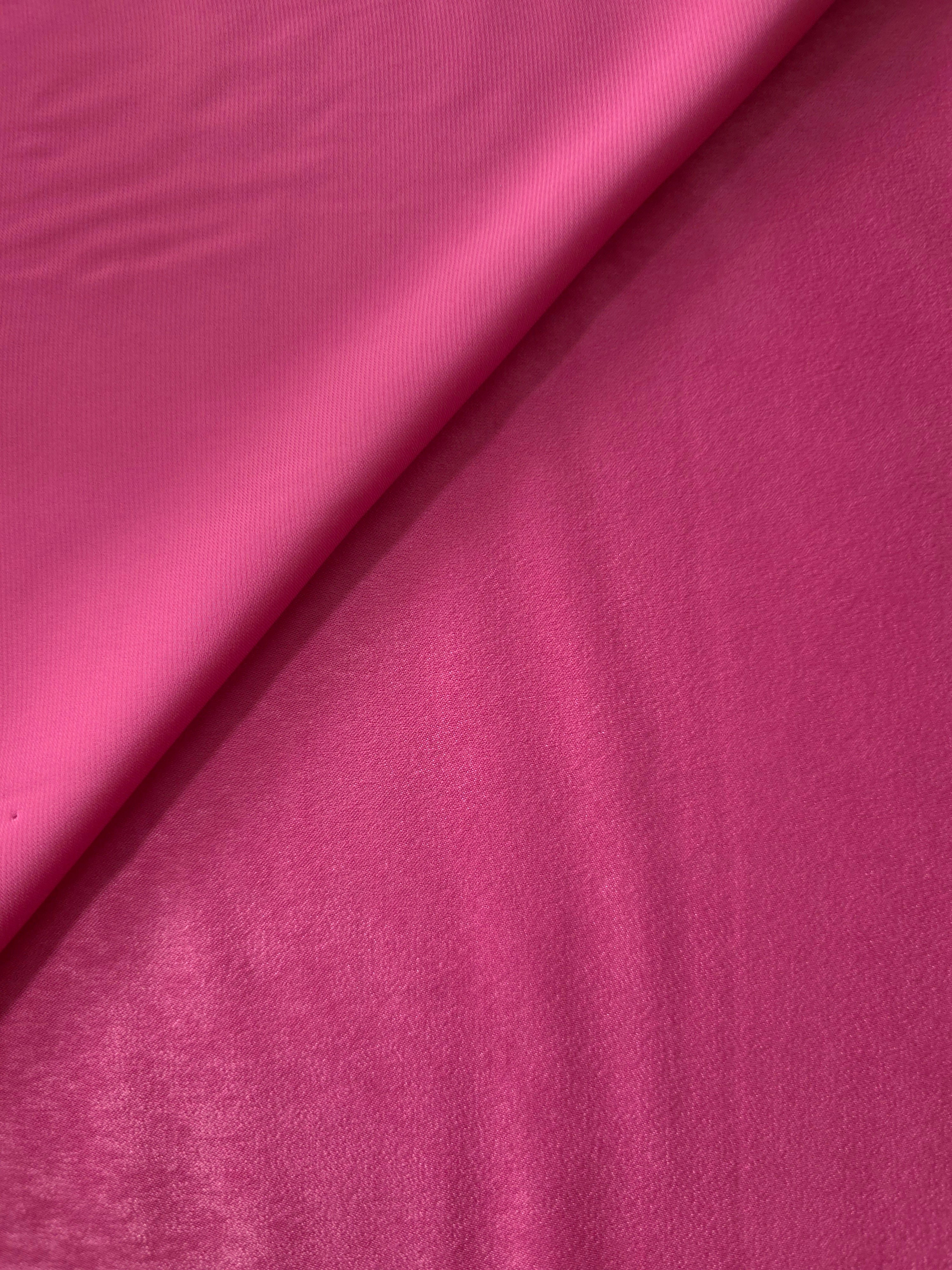 Matte silky sandwashed polyamide fabric in Raspberry Pink for dresses and apparel