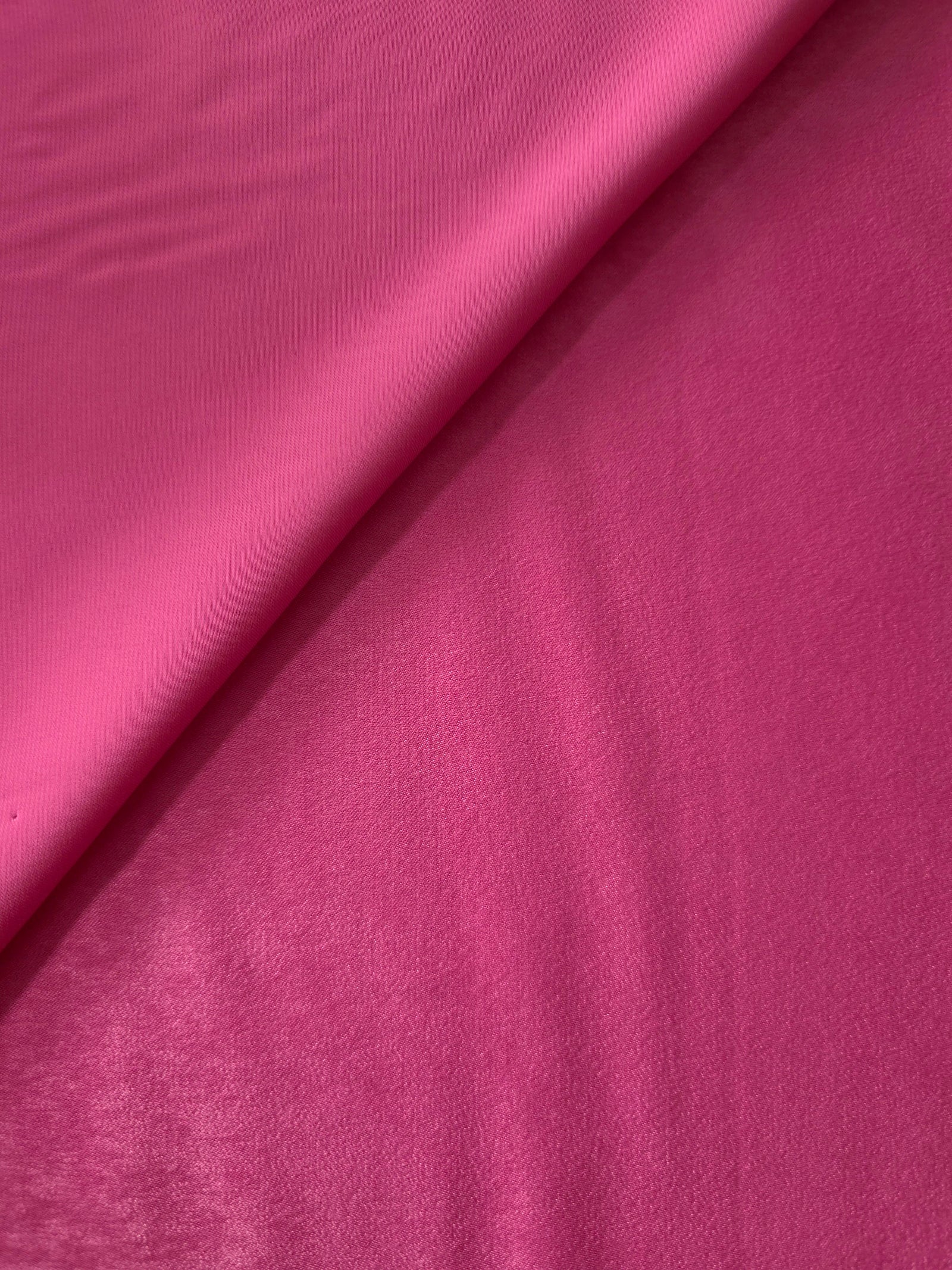 Matte silky sandwashed polyamide fabric in Raspberry Pink for dresses and apparel