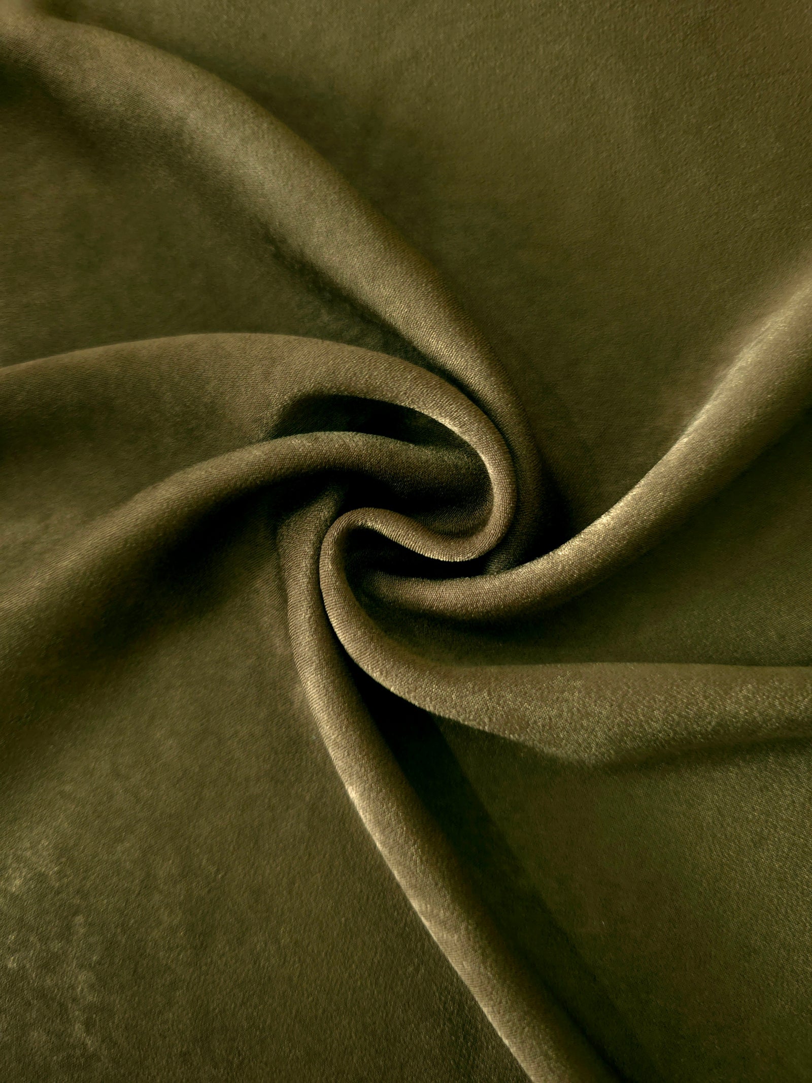 Matte silky sandwashed polyamide fabric in Deep Olive for dresses and apparel