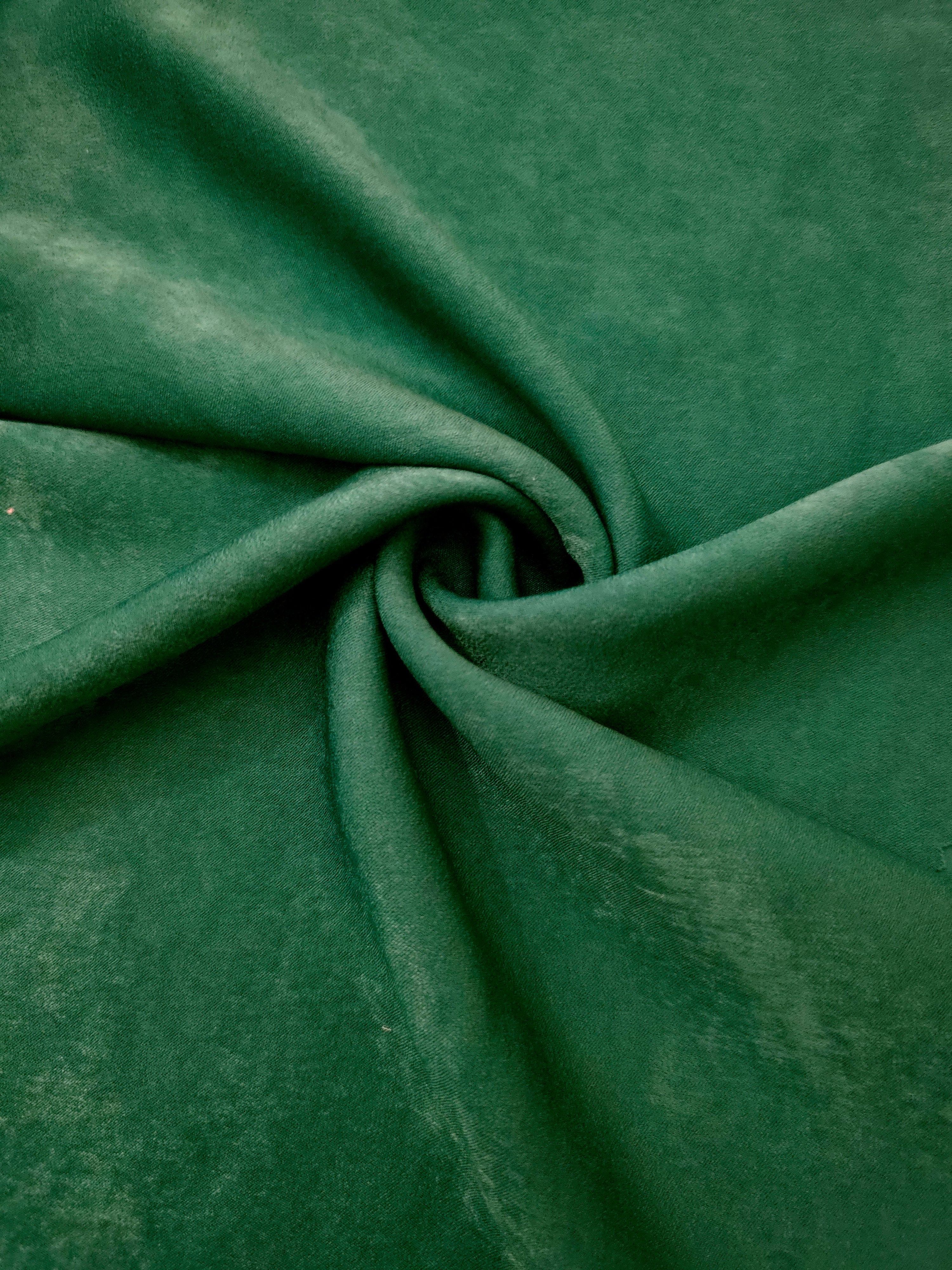 Matte silky sandwashed polyamide fabric in Emerald Green for dresses and apparel