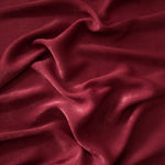 Matte silky sandwashed polyamide fabric in Deep Burgundy for dresses and apparel
