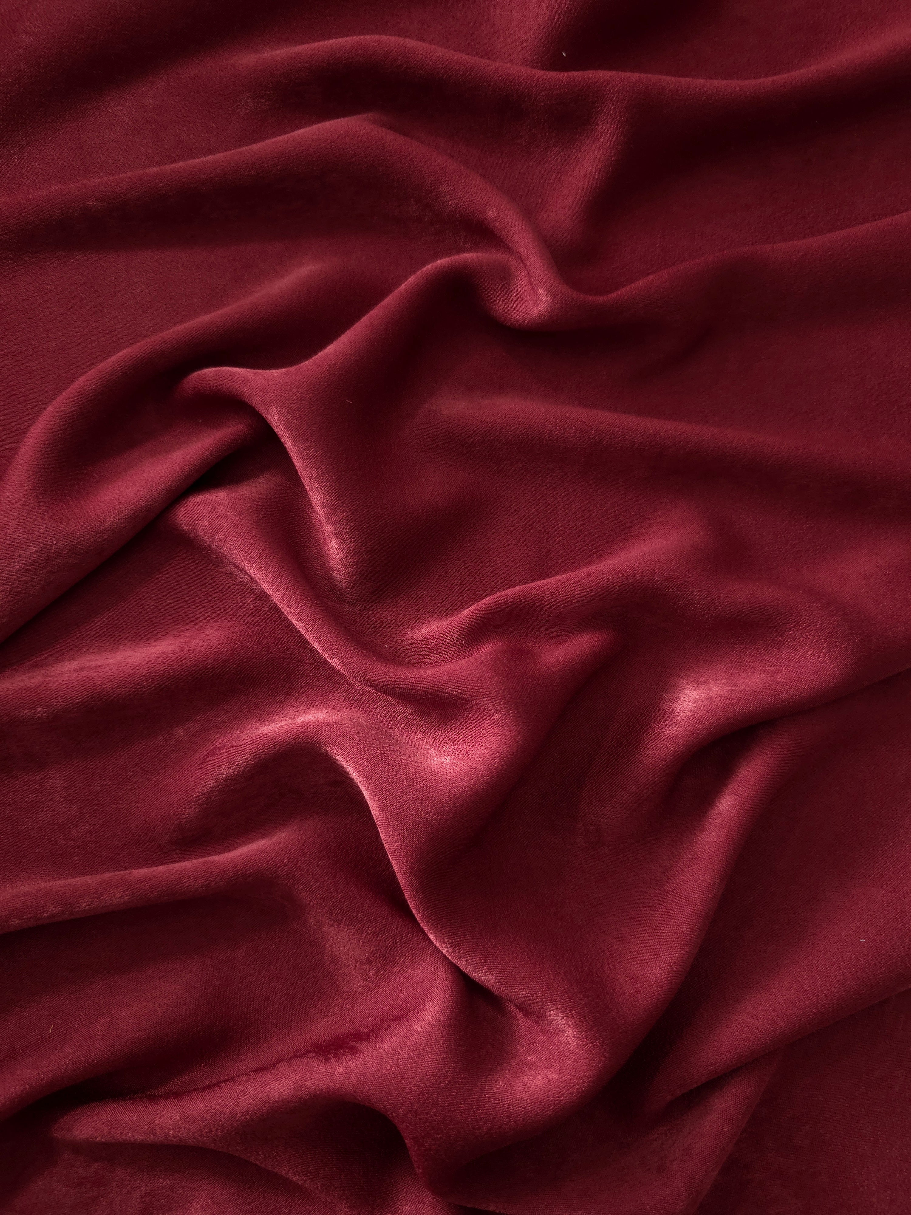 Matte silky sandwashed polyamide fabric in Deep Burgundy for dresses and apparel
