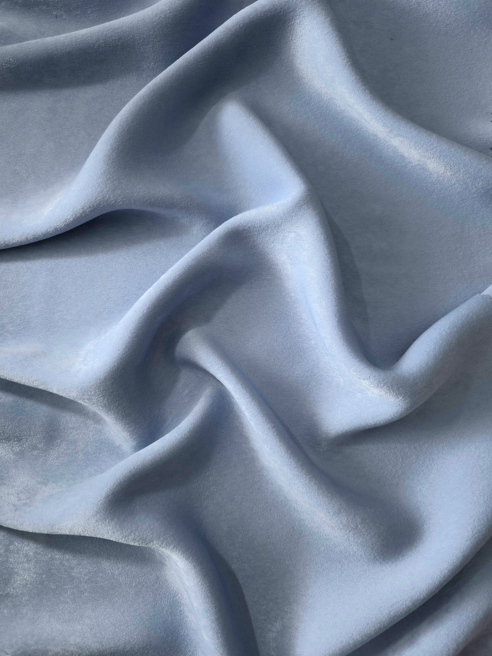 Matte silky sandwashed polyamide fabric in Silver Blue for dresses and apparel
