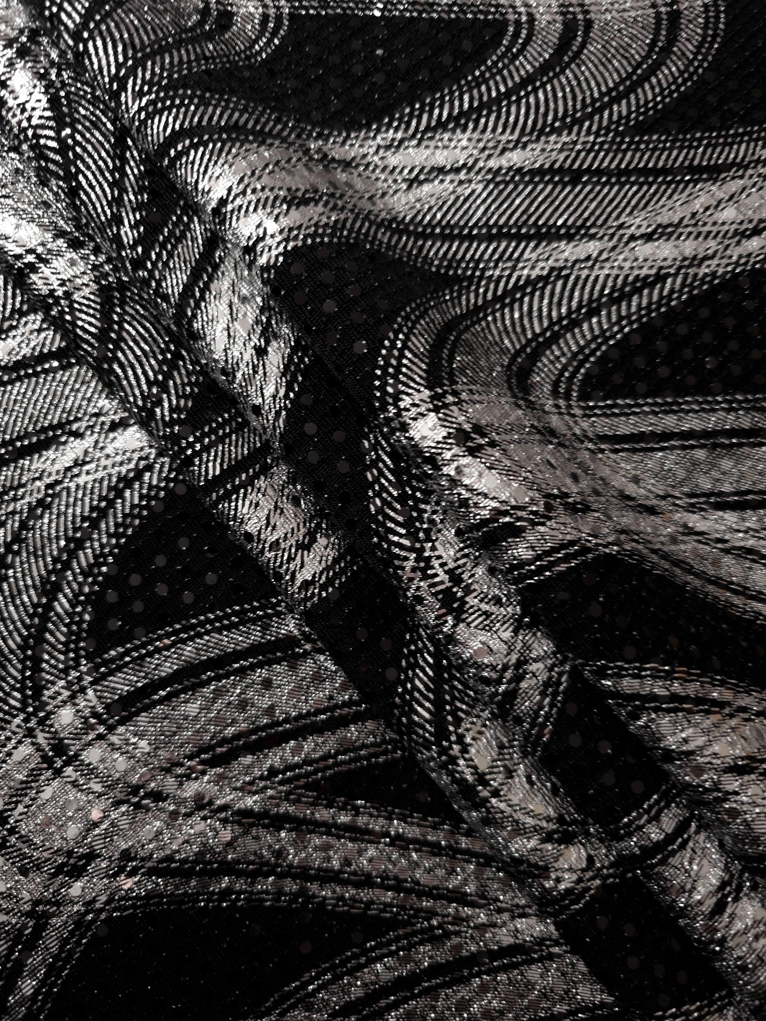 Silver Gray Fluid Waves foil sequin mesh arranged in relaxed folds, showing a lightweight layered effect for prom dresses, cocktail looks and statement overlays.