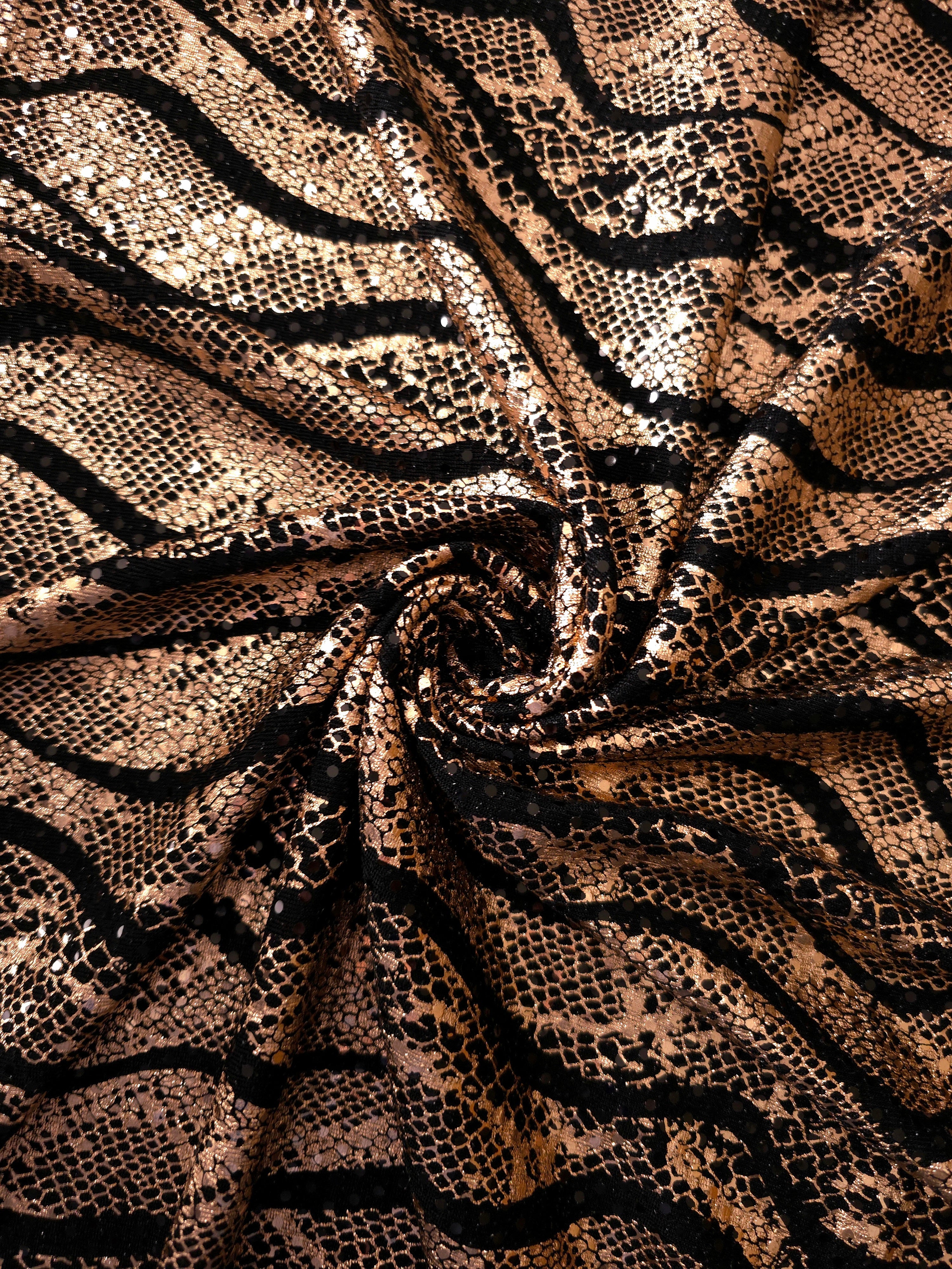 Sculpted twist of Rose Gold Wavy Python sequin fabric reveals metallic highlights and flowing black tulle underneath for special-occasion garments, performance pieces and overlays.