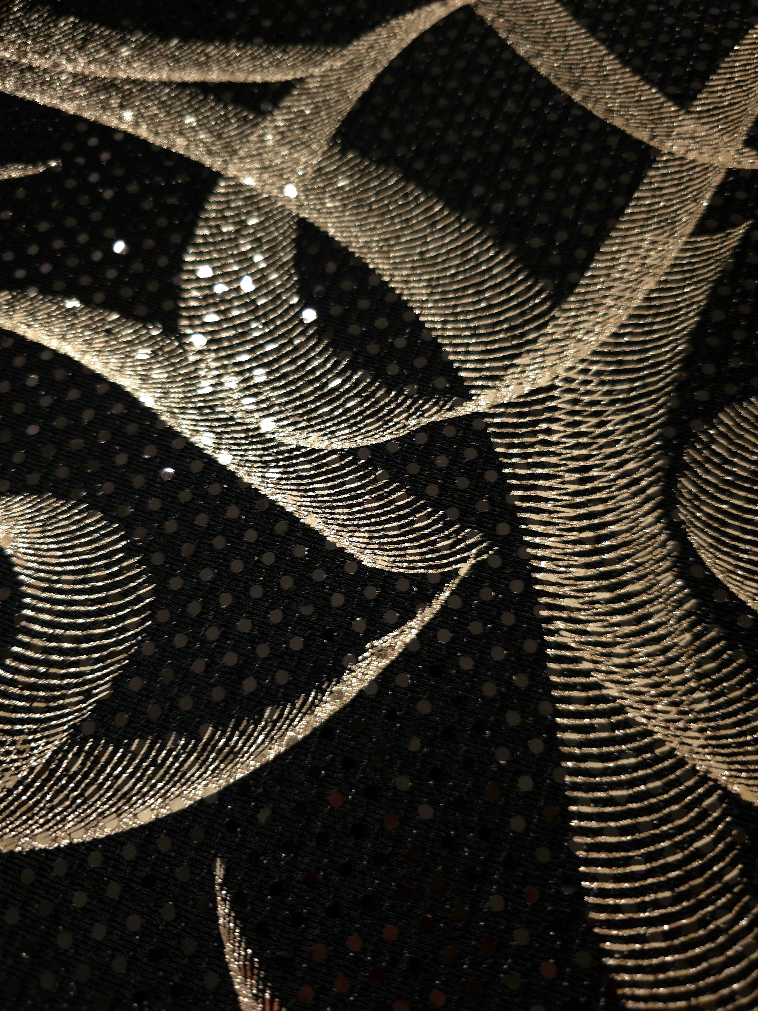 Soft Gold Abstract Ribbon foil sequin fabric photographed flat to show crisp motif placement and reflective texture for partywear, fashion tops and theatrical costumes.