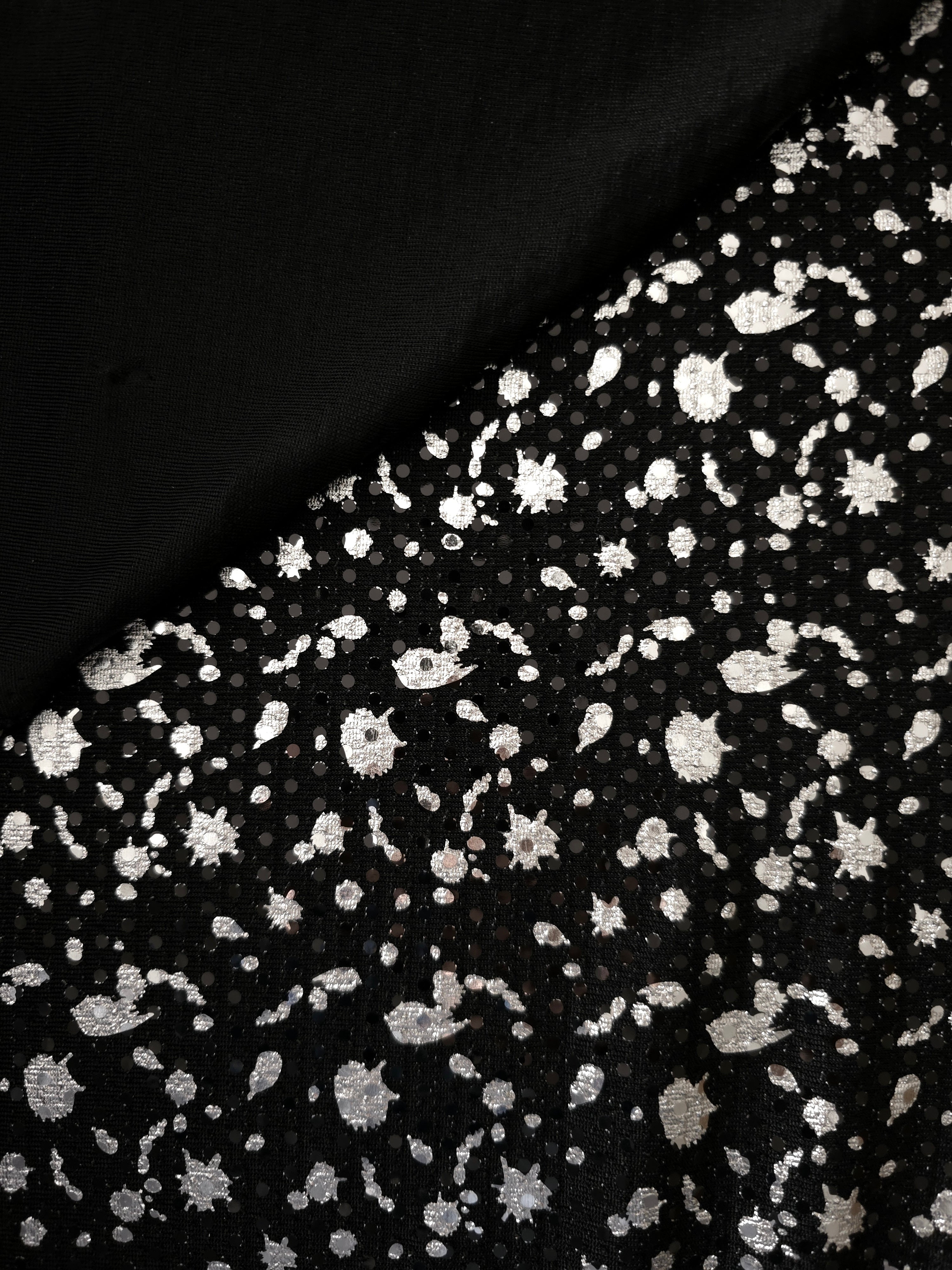 Layered folds in Silver Gray Cosmic Splatter metallic sequin tulle emphasize texture, sparkle and dimensional pattern for special-occasion dresses, sleeves and decorative panels.