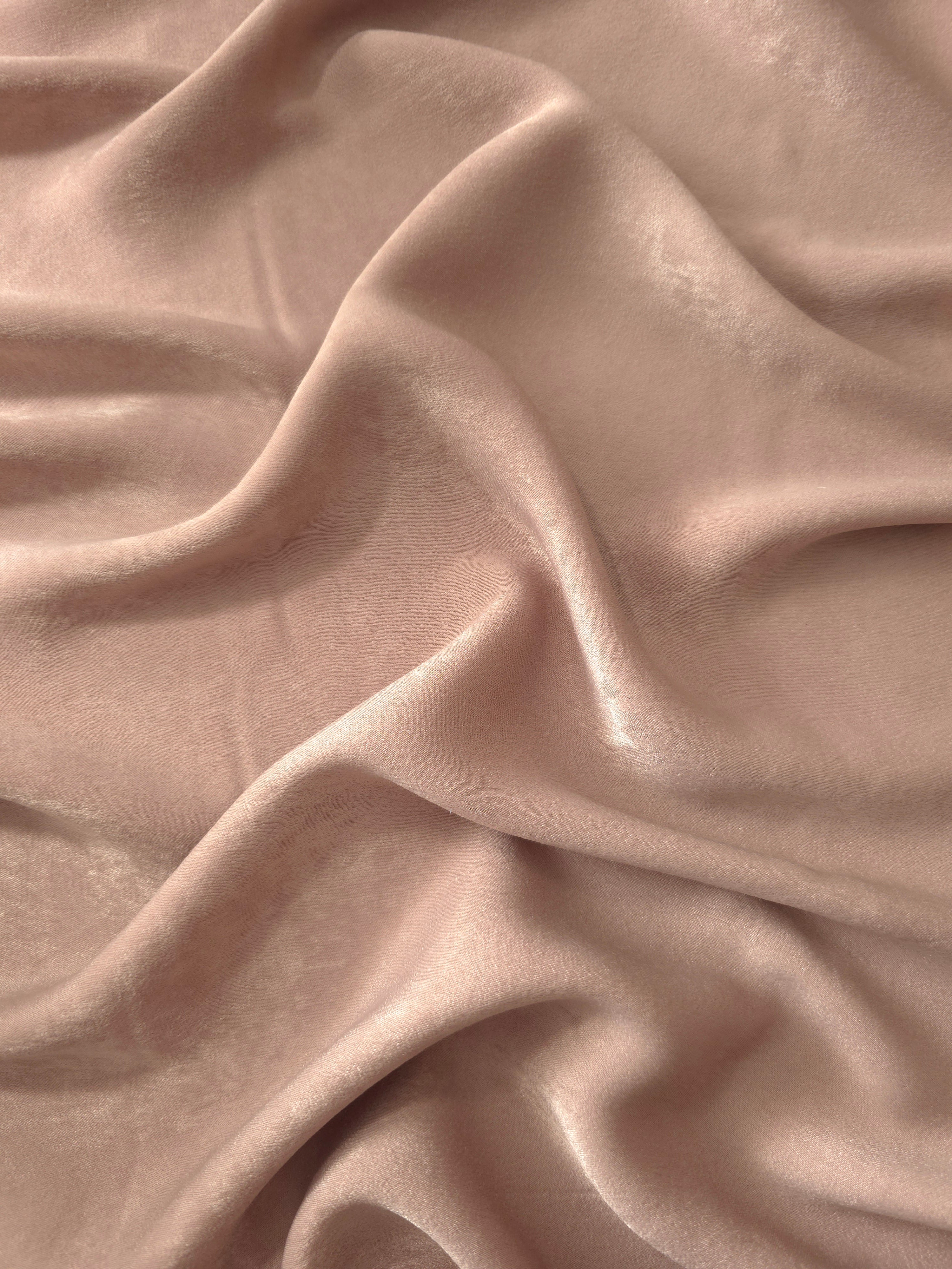 Milano matte sandwashed silky fabric in Blush Taupe, shown as a soft textile for dresses, blouses and apparel