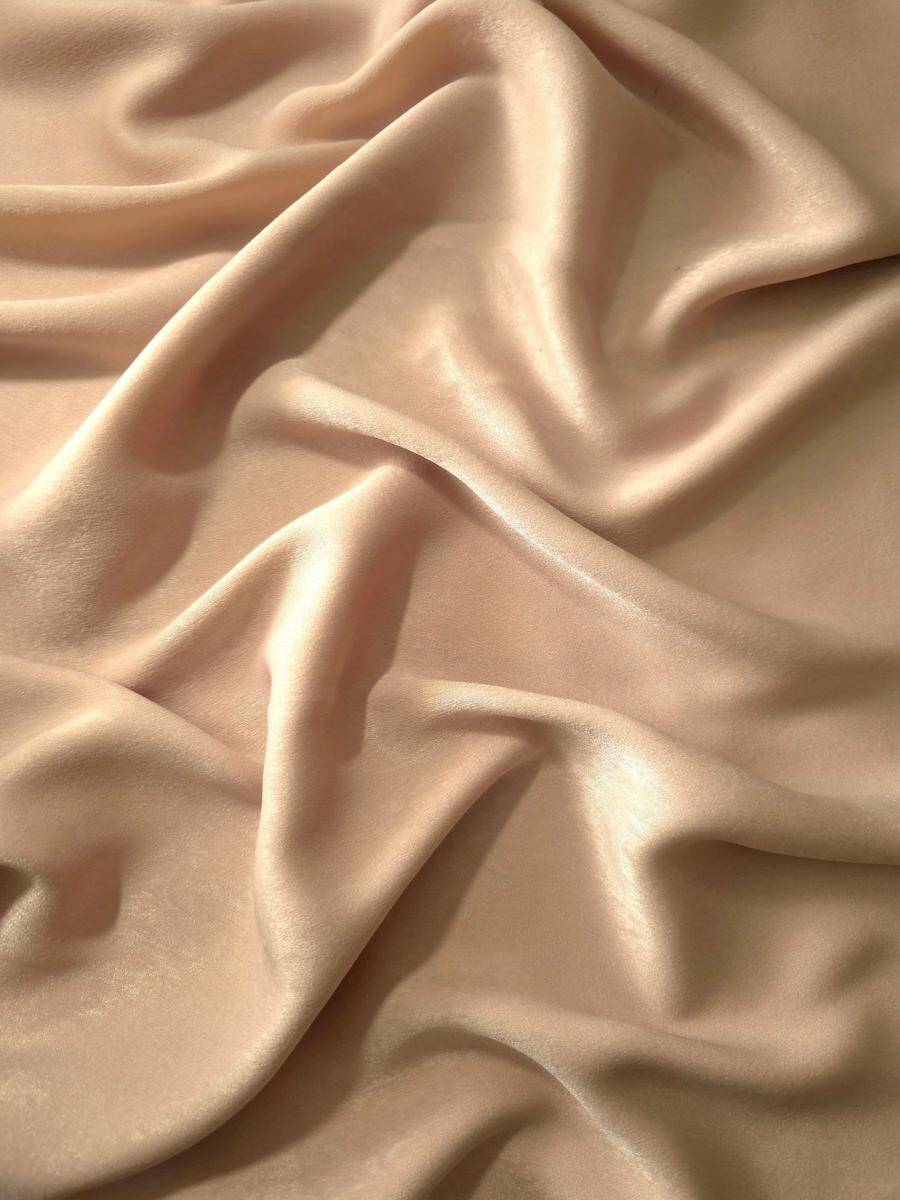 Milano matte sandwashed silky fabric in Camel Sand, shown as a soft textile for dresses, blouses and apparel