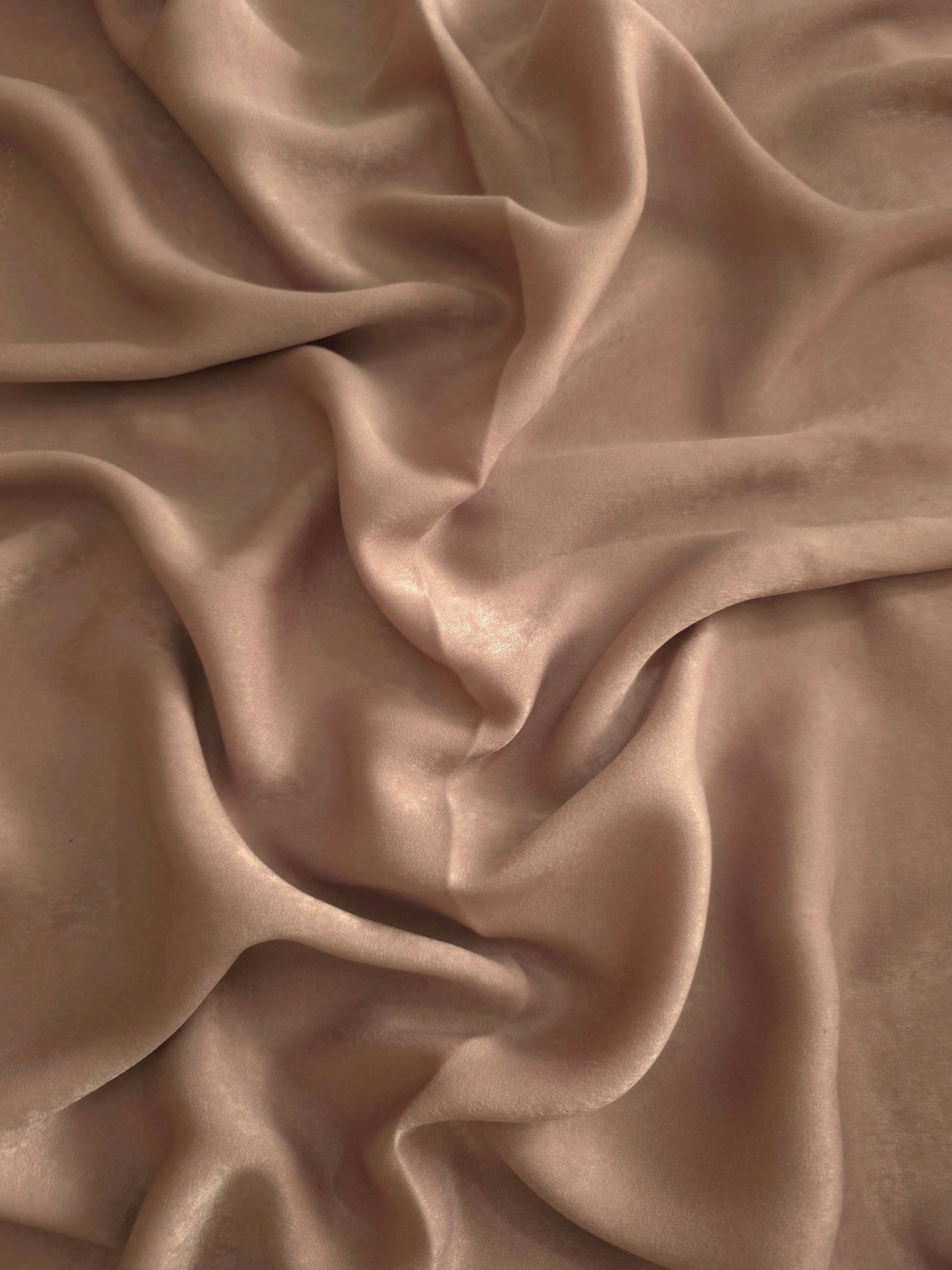 Milano matte sandwashed silky fabric in Cappuccino Taupe, shown as a soft textile for dresses, blouses and apparel