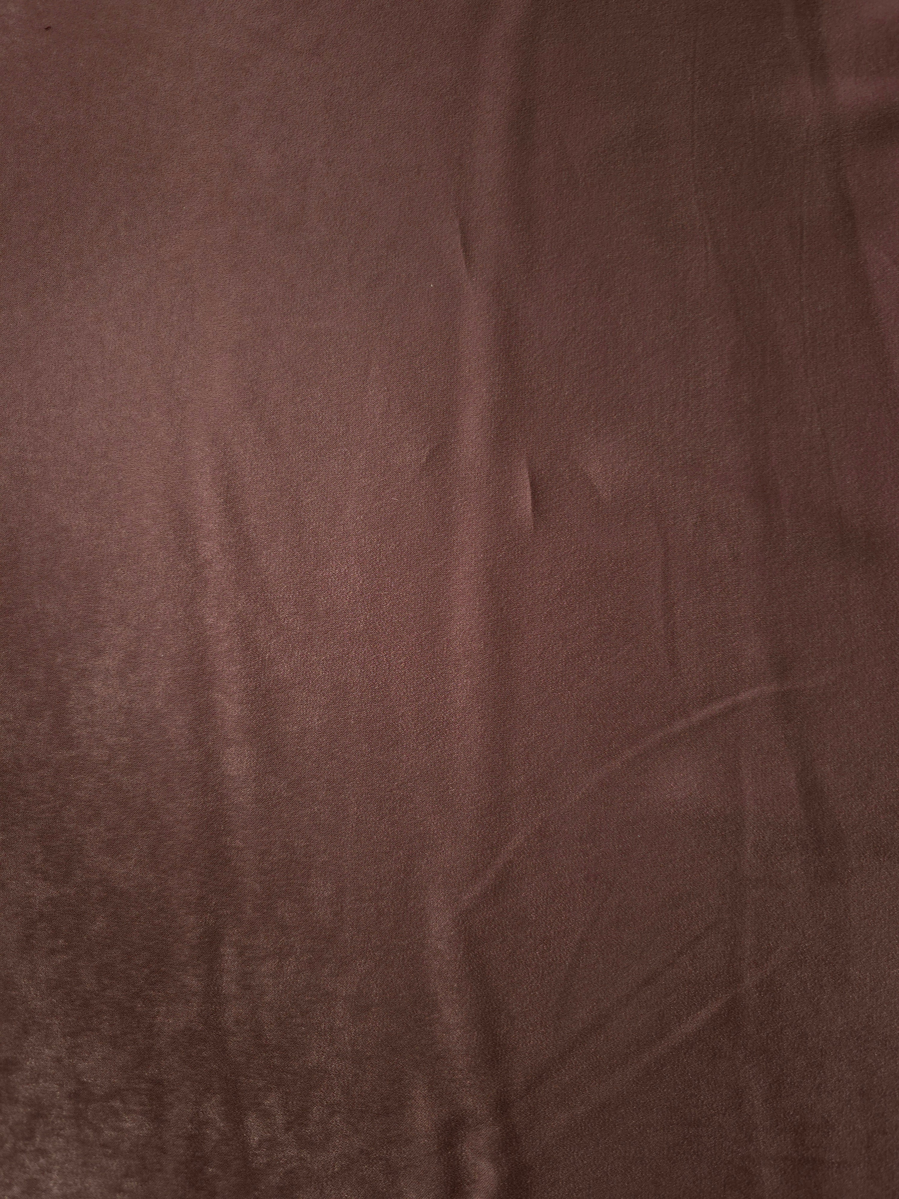 Close-up of Chestnut Wine Milano sandwashed silky fabric showing its smooth matte texture and soft surface