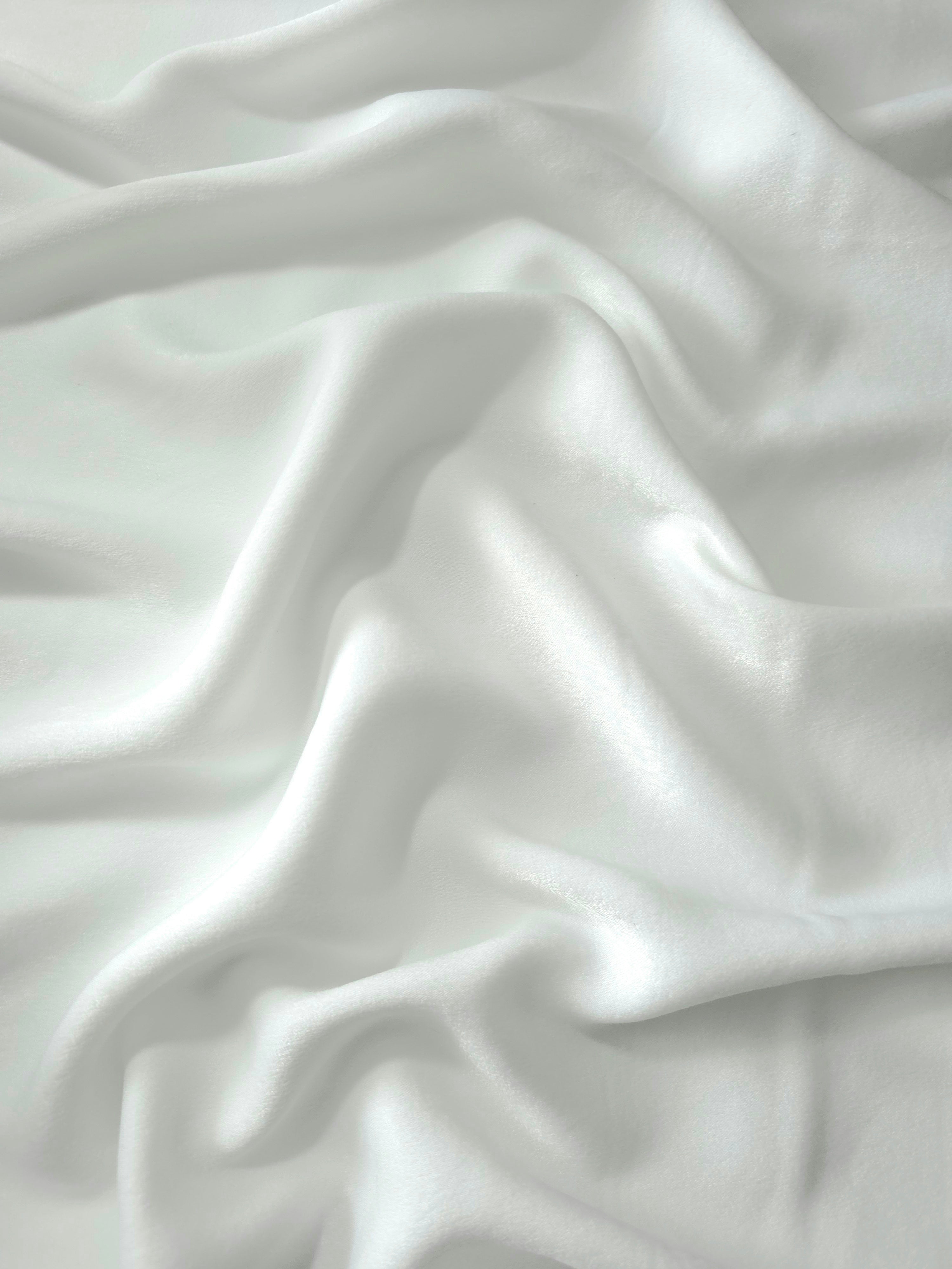 Close-up of Frosted Silver Milano sandwashed silky fabric showing its smooth matte texture and soft surface