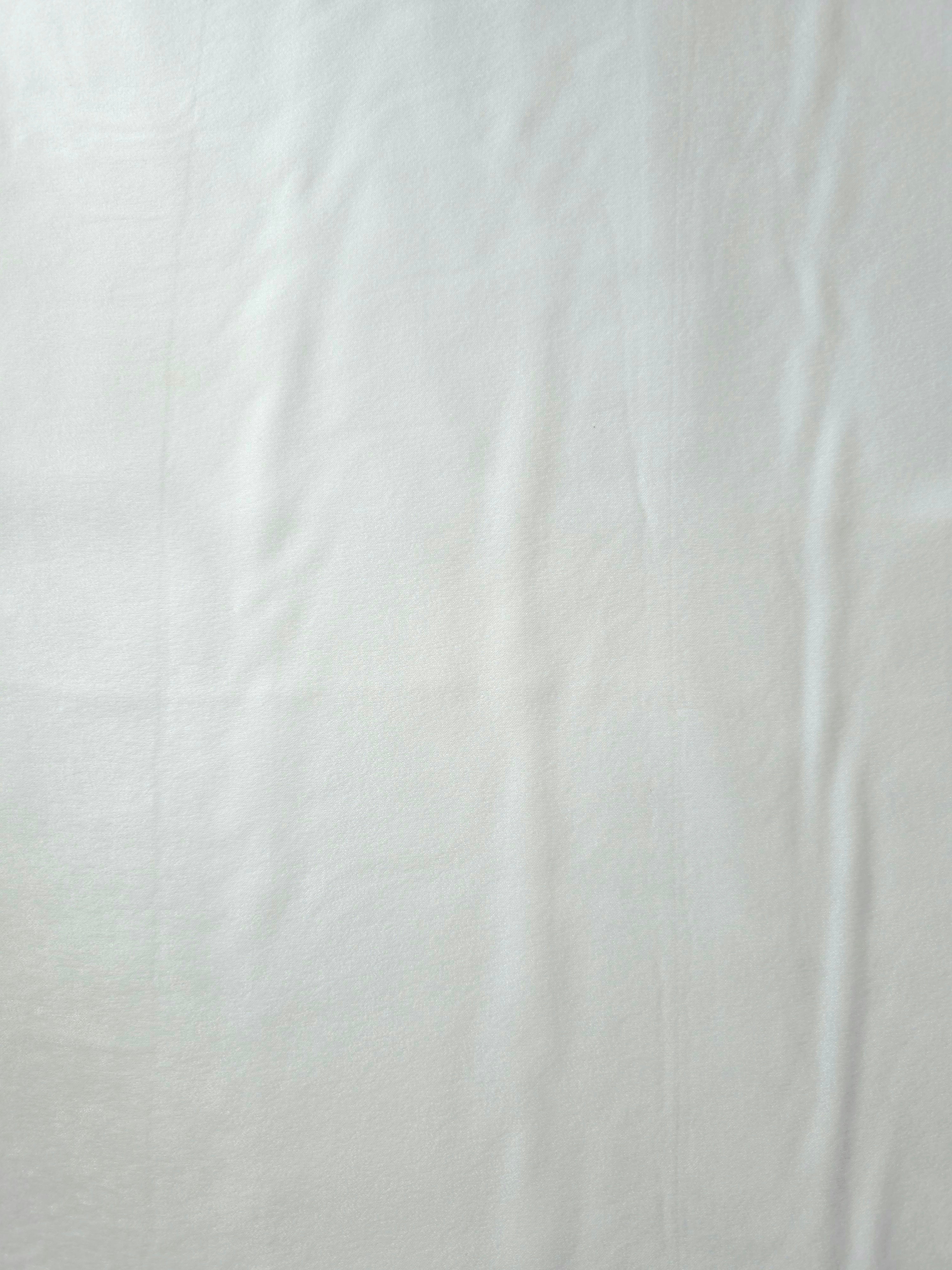 Draped Frosted Silver Milano matte sandwashed silky fabric showing fluid movement for dresses and occasionwear