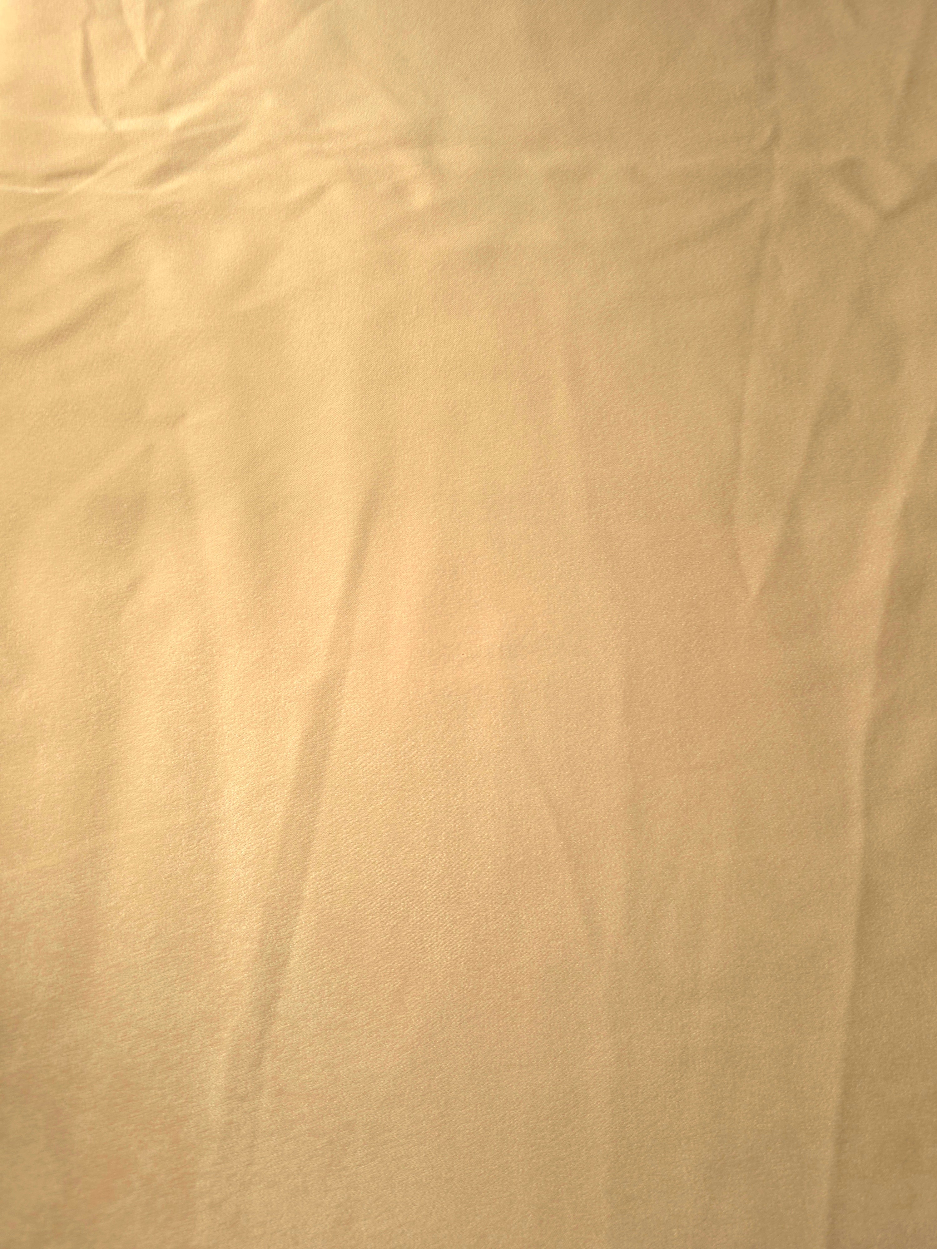 Draped Golden Wheat Milano matte sandwashed silky fabric showing fluid movement for dresses and occasionwear