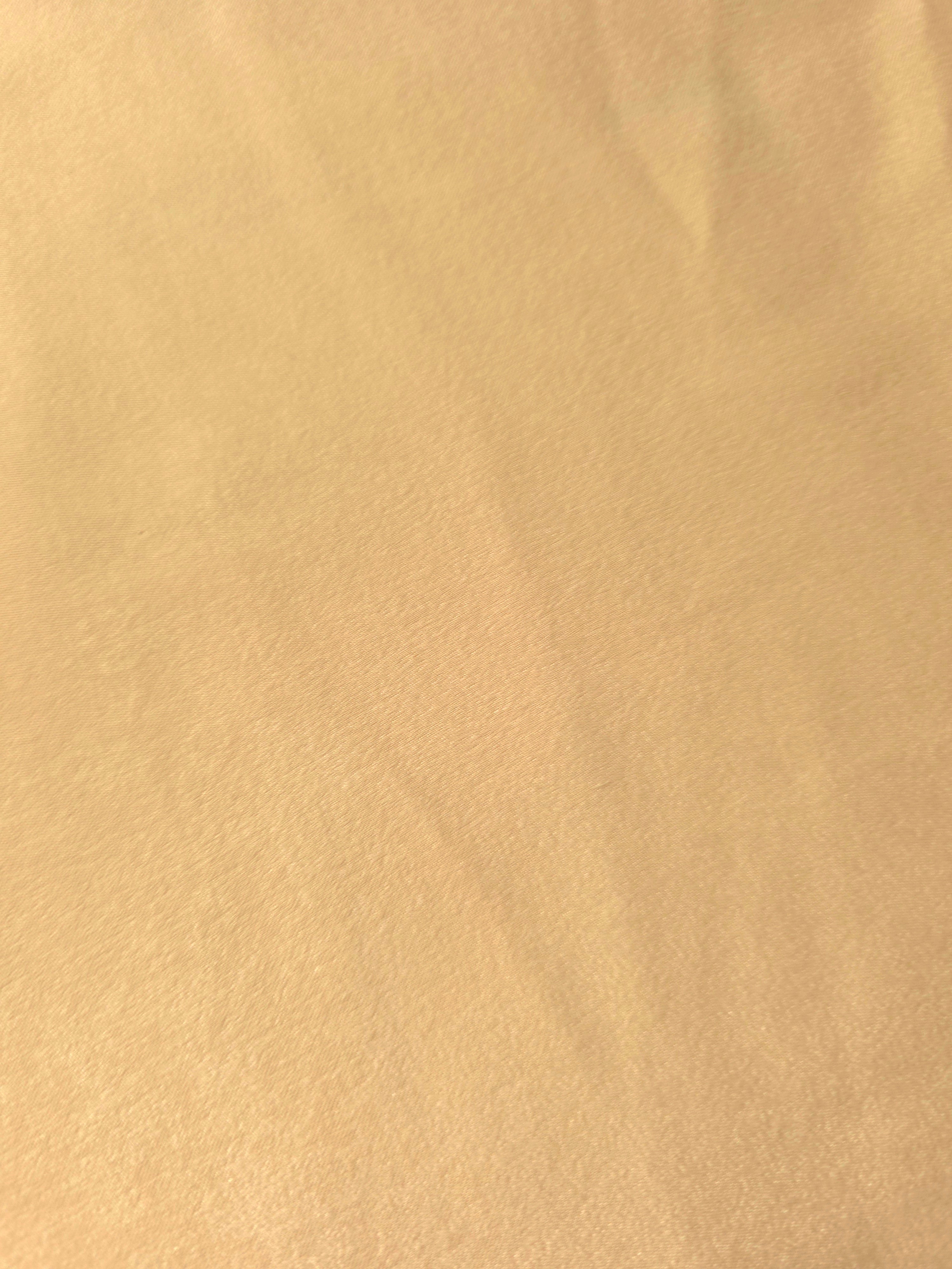 Golden Wheat Milano sandwashed silky fabric with a soft fluid drape and smooth flowing folds