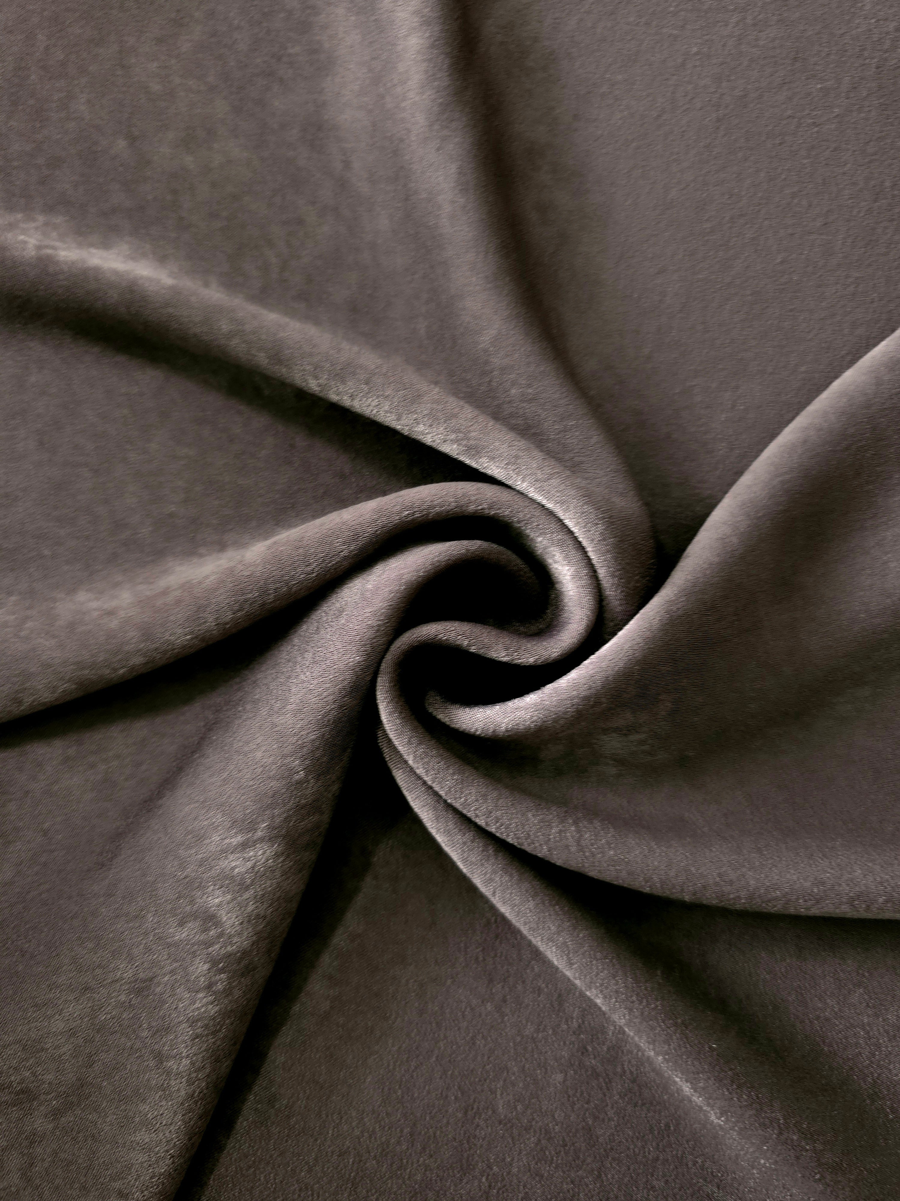 Milano matte sandwashed silky fabric in Graphite Taupe, shown as a soft textile for dresses, blouses and apparel